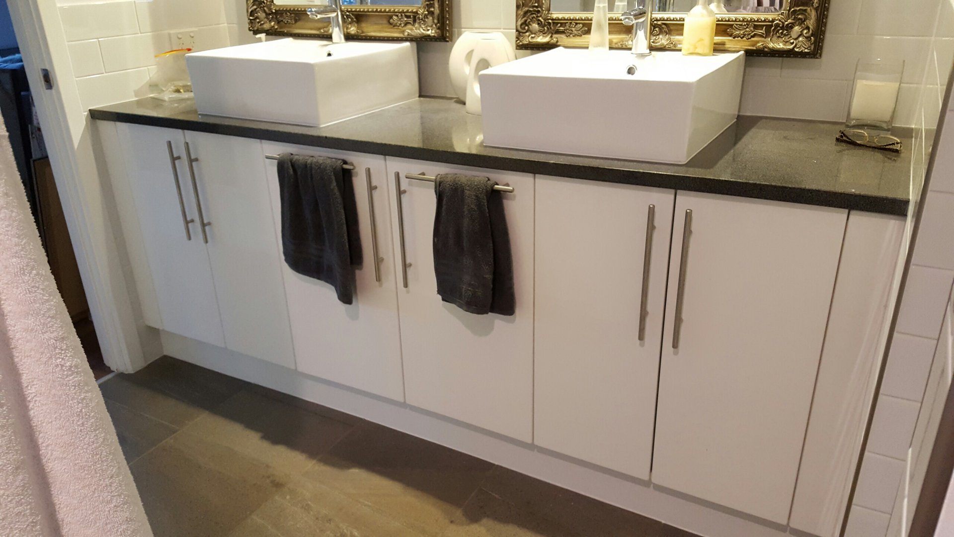 Custom commercial banquette seating with tan leather upholstery and timber legs