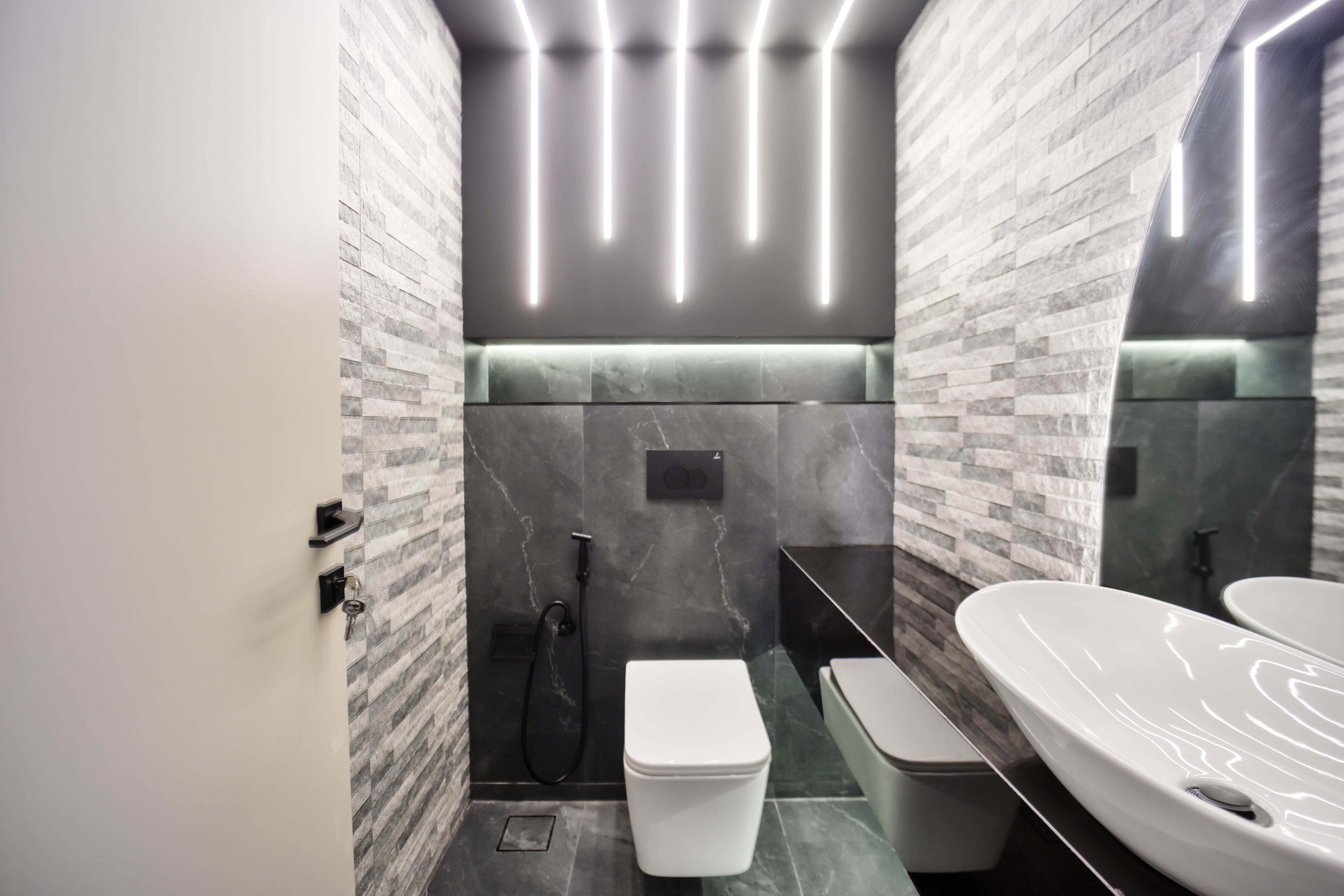 Modern bathroom with gray marble walls