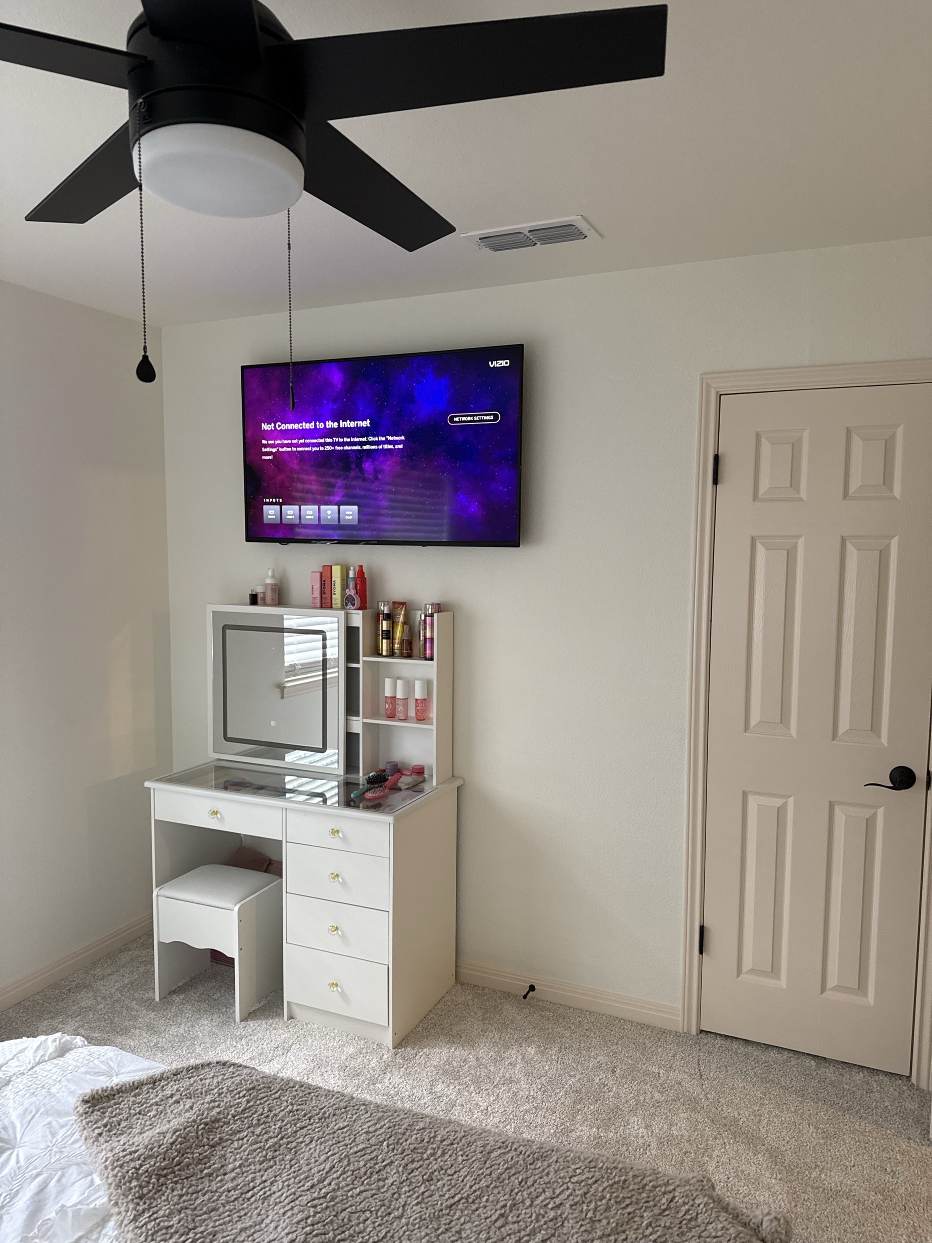 TV mounting and ceiling fan installation in bedroom