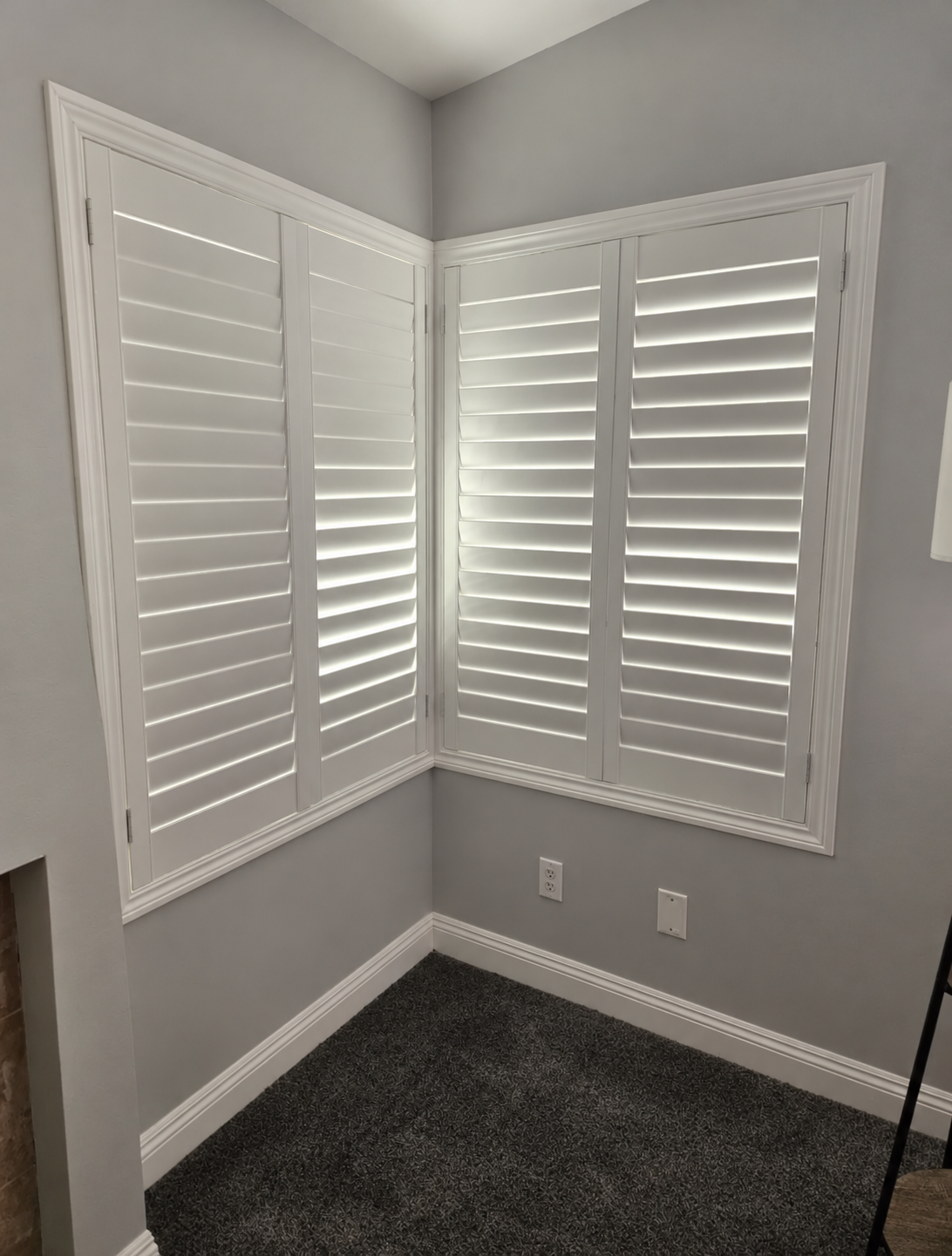 White corner plantation shutters