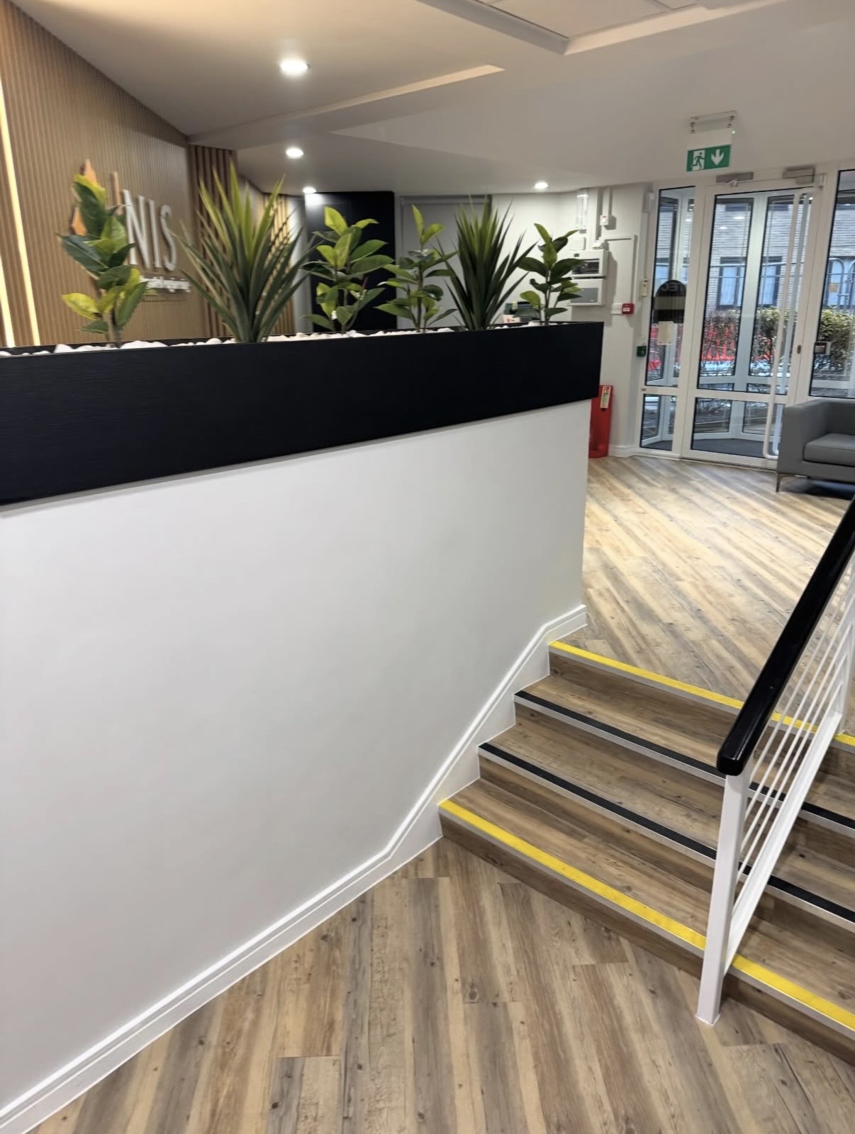 Office staircase with wood effect flooring and safety nosings