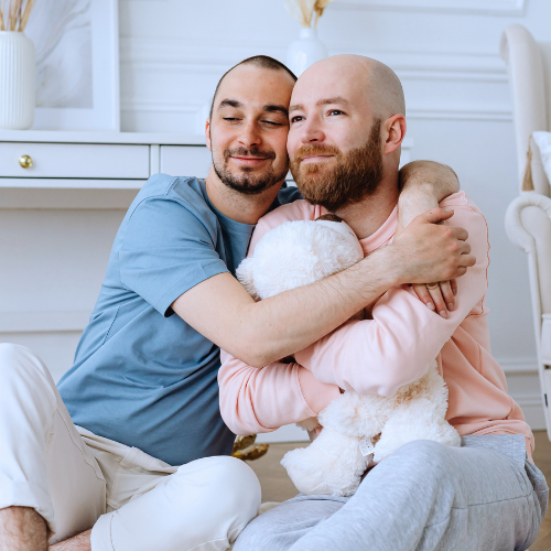 Couple embracing with their dog