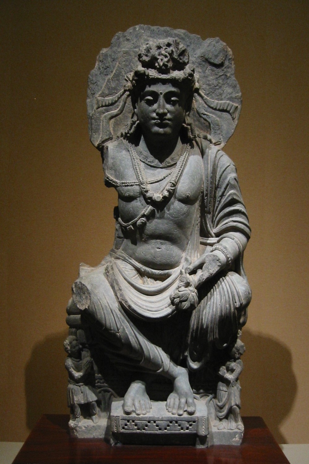 Gandharan stone sculpture of a seated bodhisattva