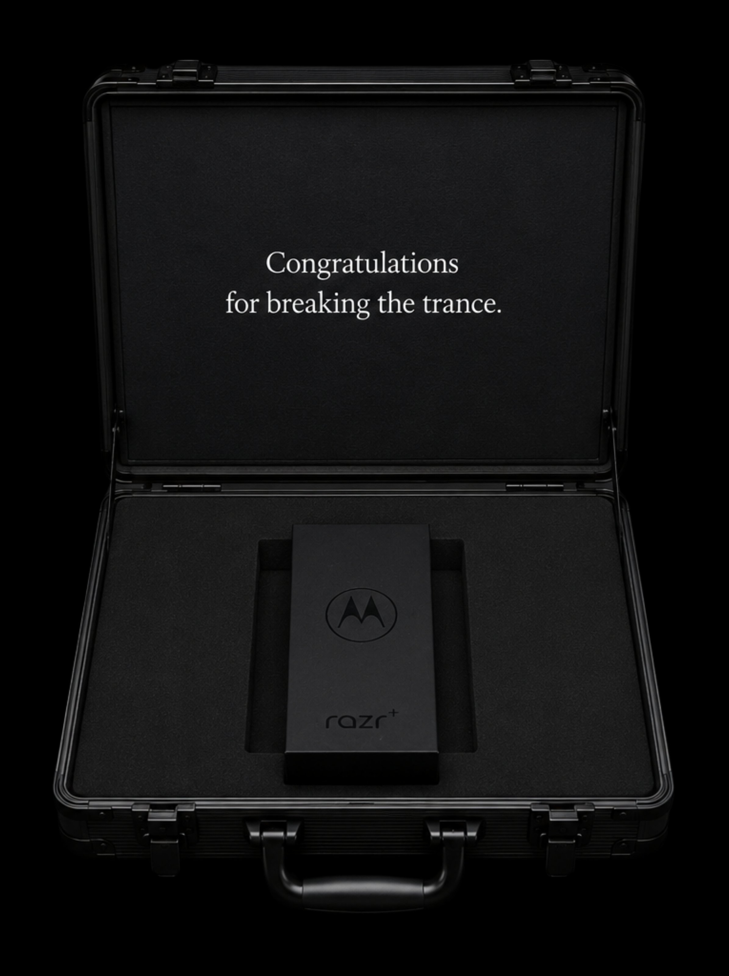 The opened case: Congratulations for breaking the trance, with the Razr+ inside