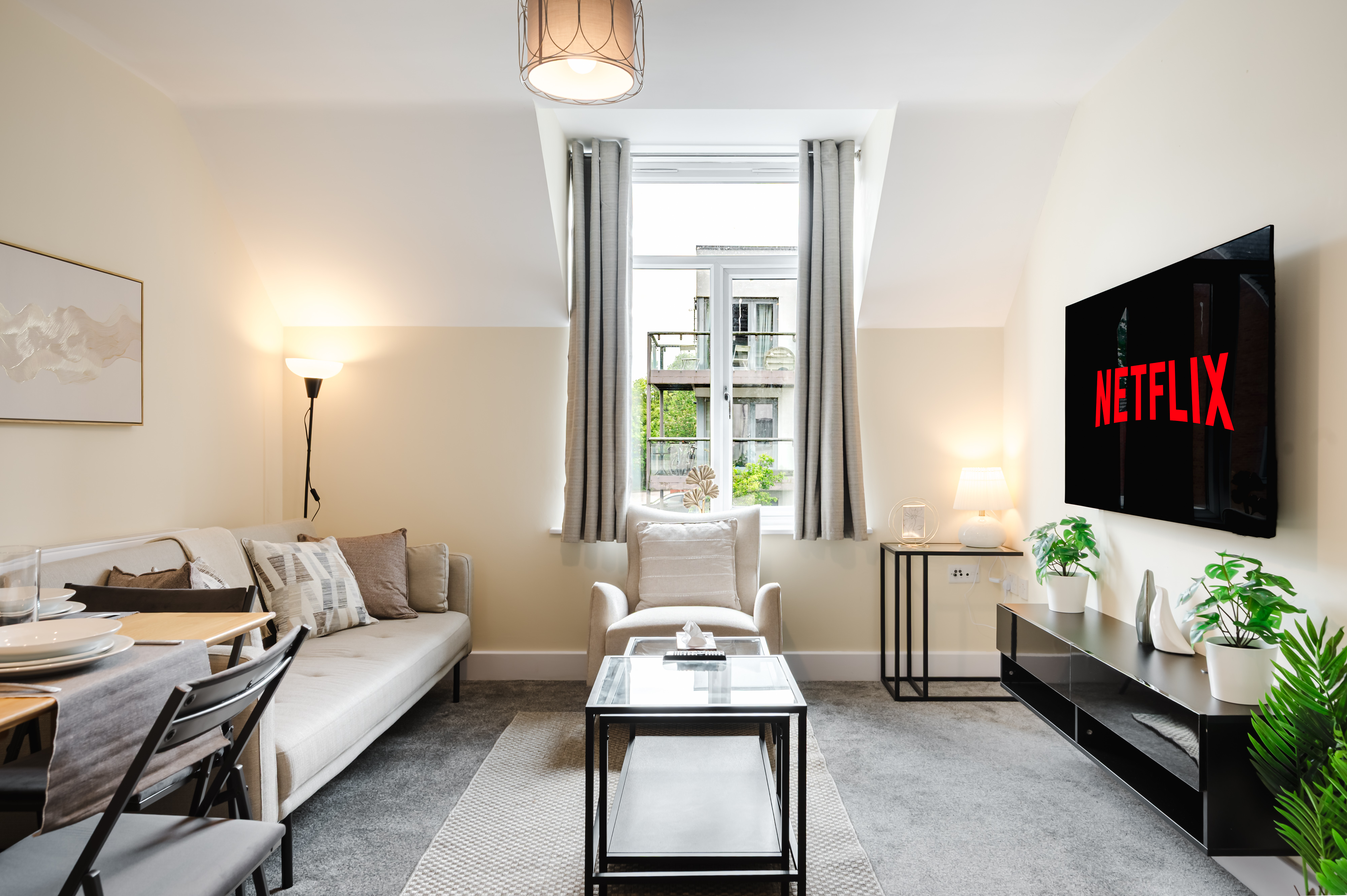 Modern 2-bedroom apartment with comfortable living space, smart TV, and contemporary furnishings