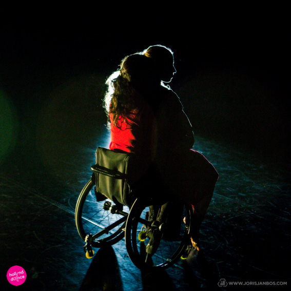 Dance Able duet, silhouette of dancer in wheelchair and standing dancer