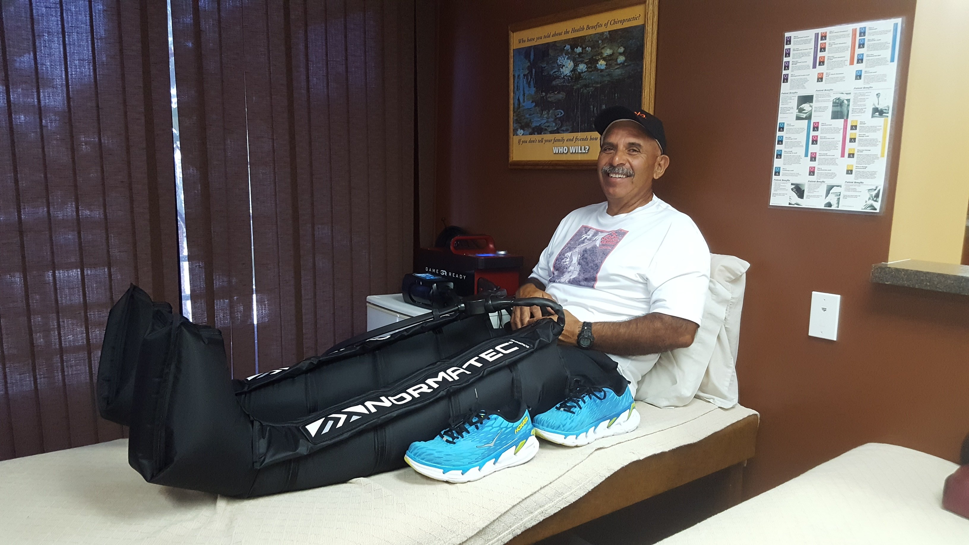 Patient using Normatec compression therapy