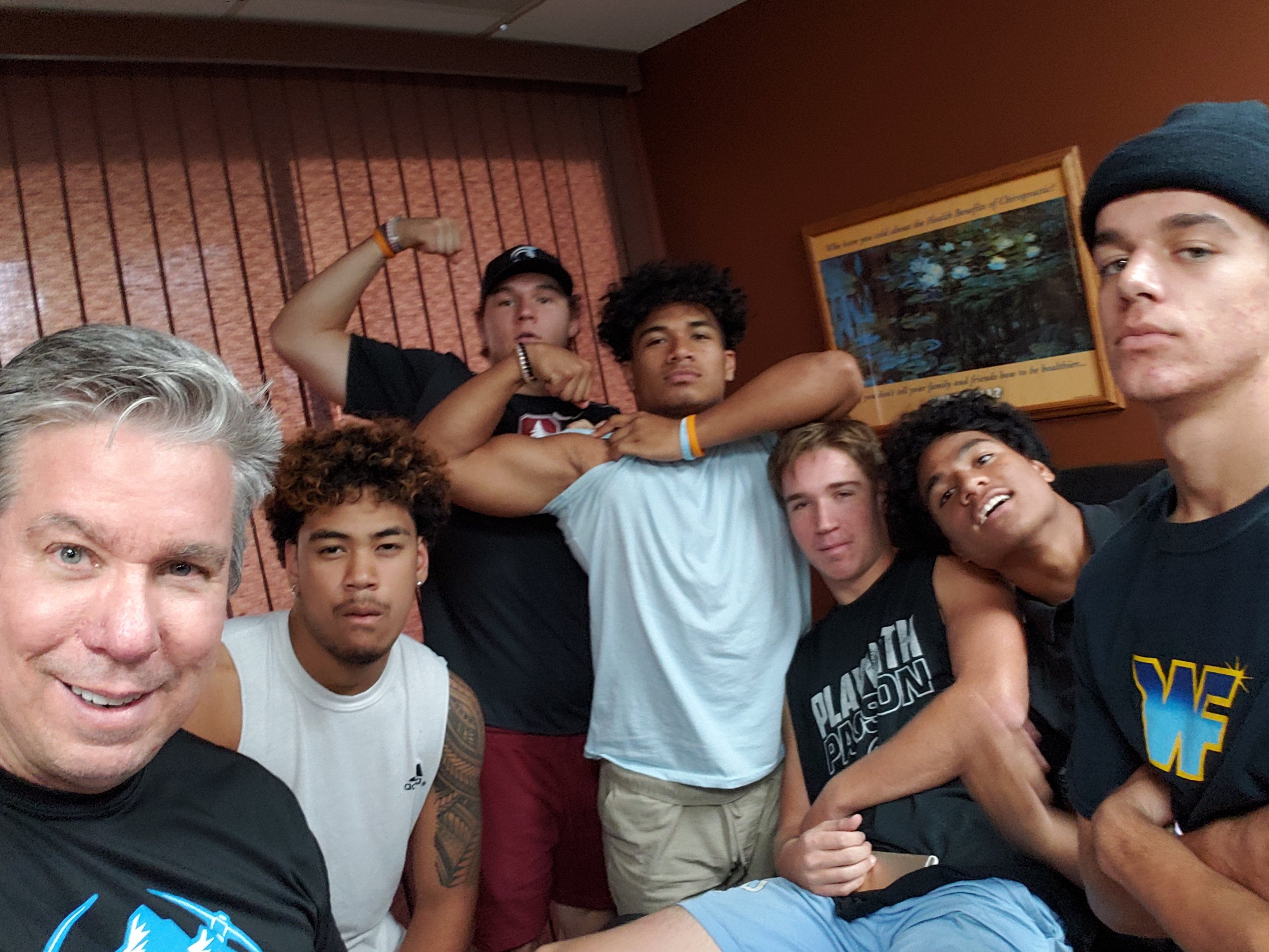 Dr. Gary with group of athletes and team members