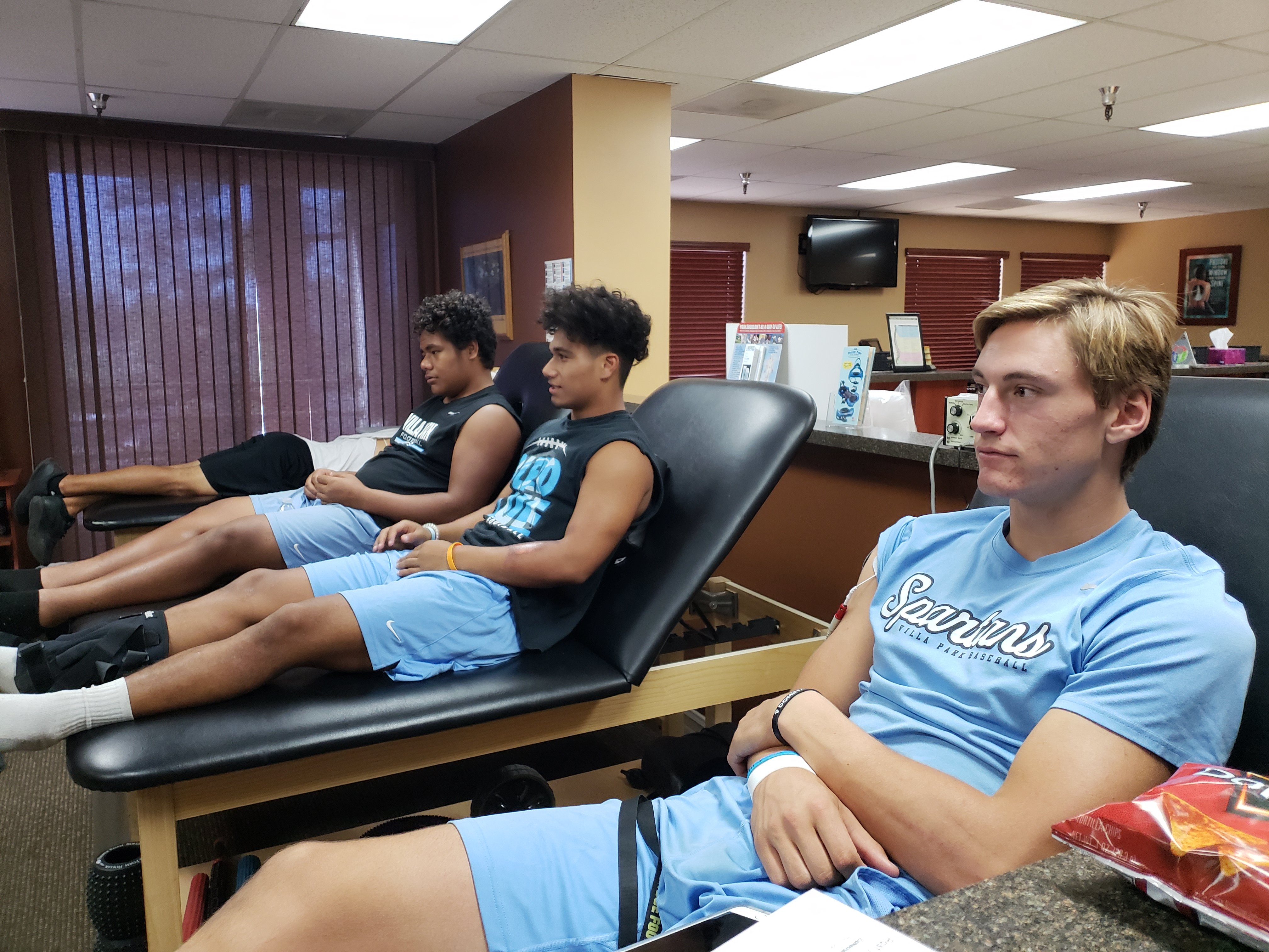 Student athletes receiving care from Dr. Gary