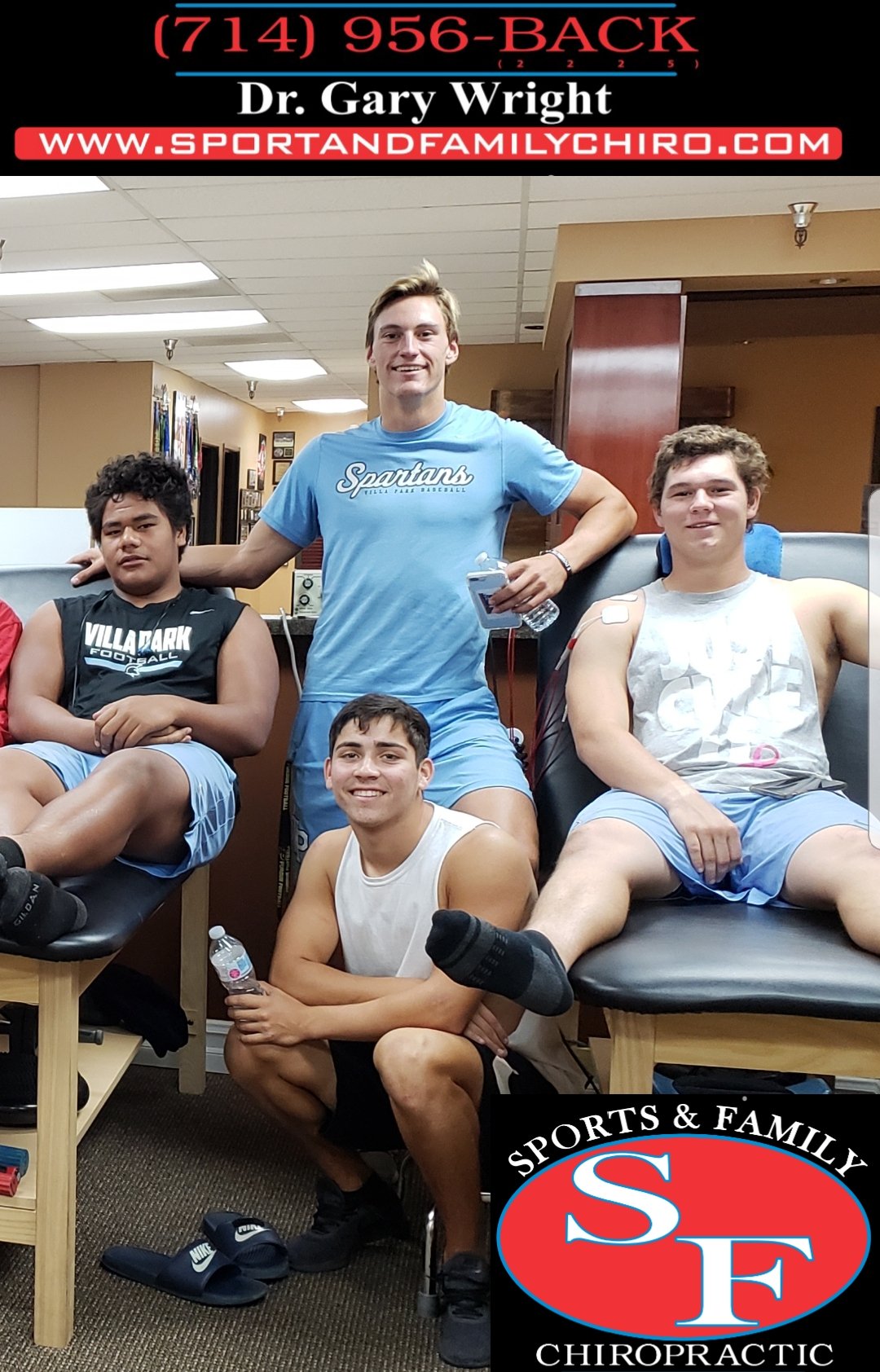 Dr. Gary with mixed group of athletes in office