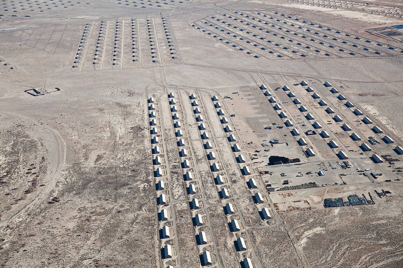 Aerial view of military storage facilities arranged in neat rows