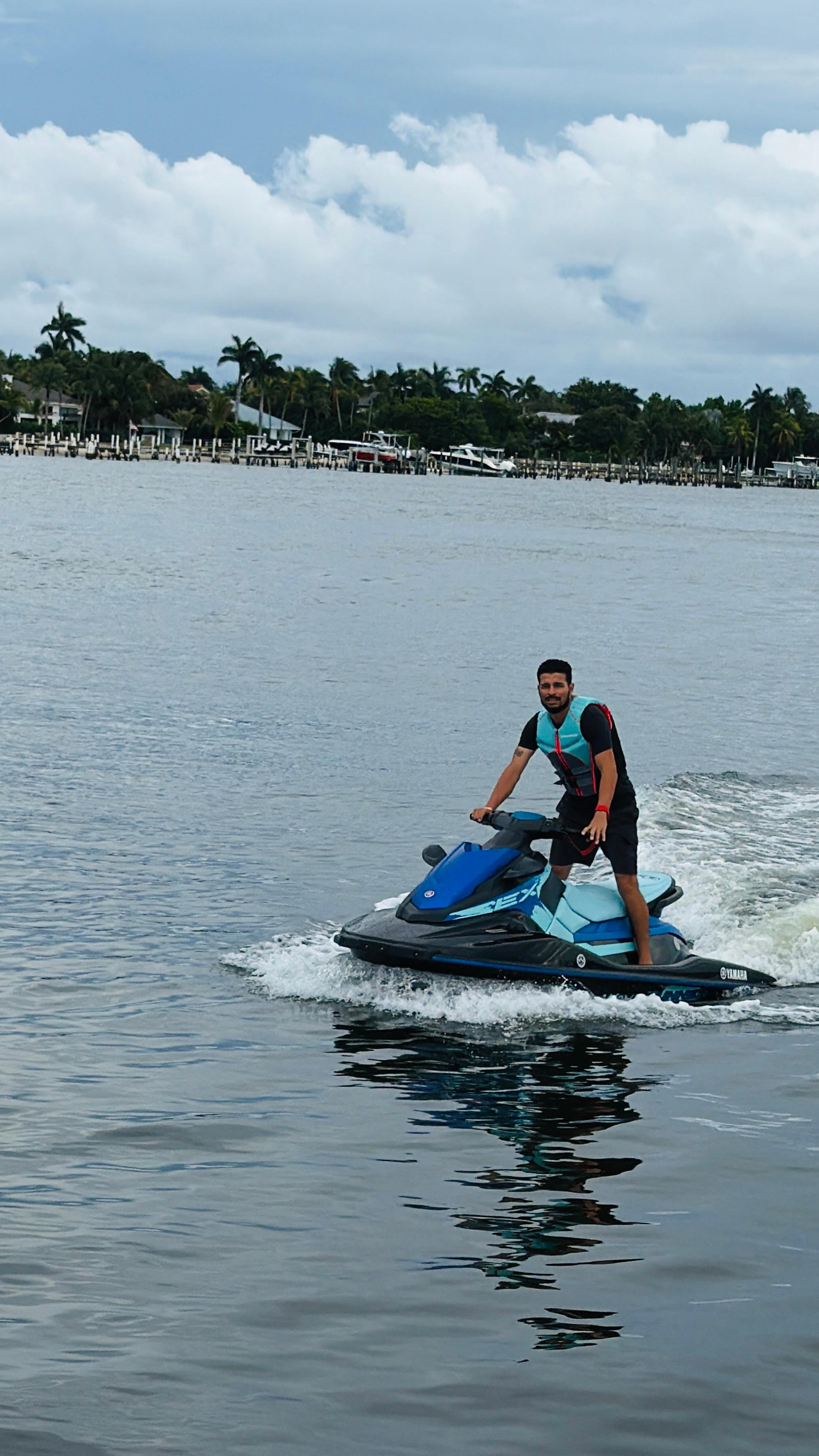 Man riding Yamaha WaveRunner standing up through the intracoastal waterway
