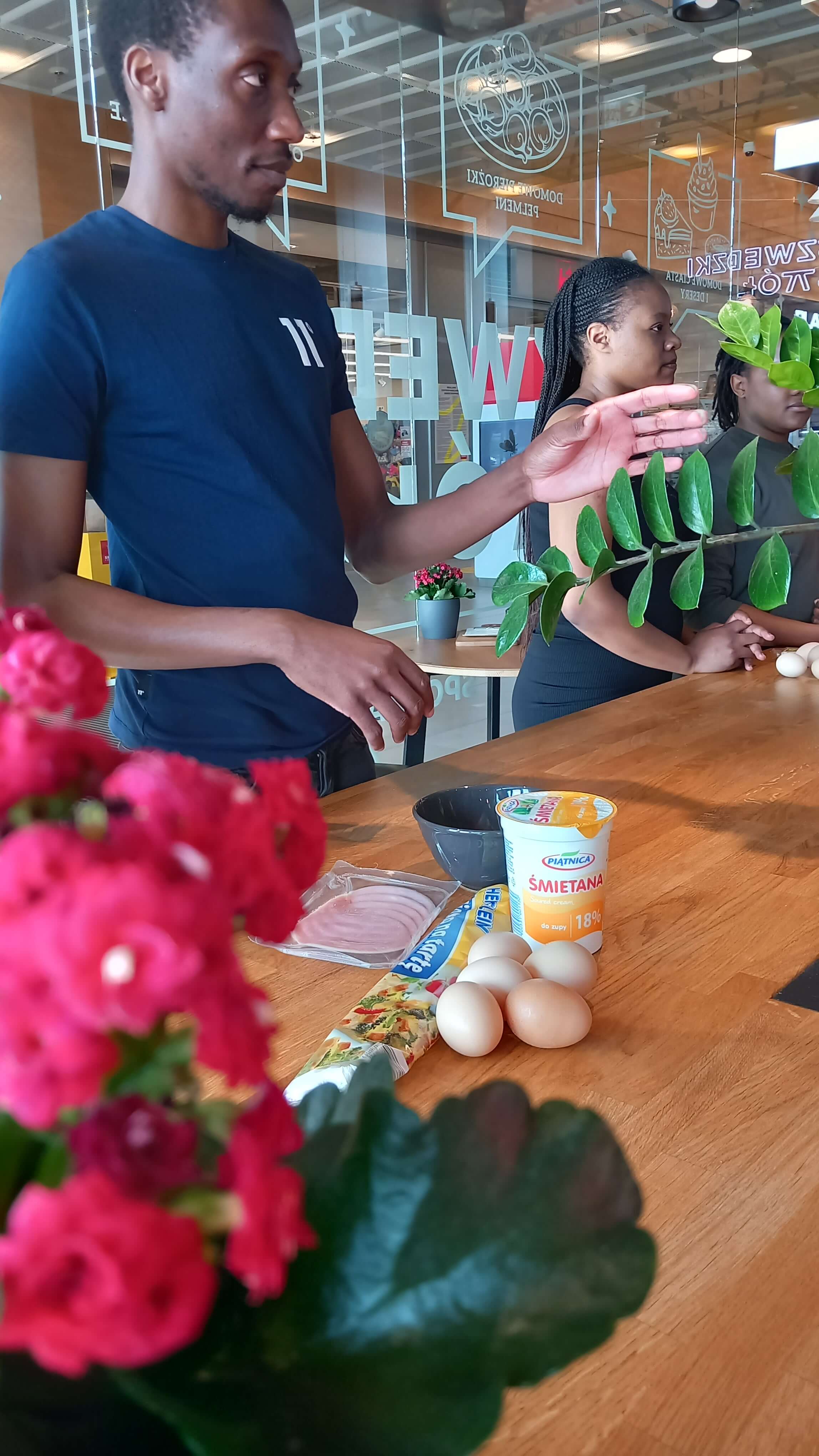 Workshop participant demonstrating cooking technique