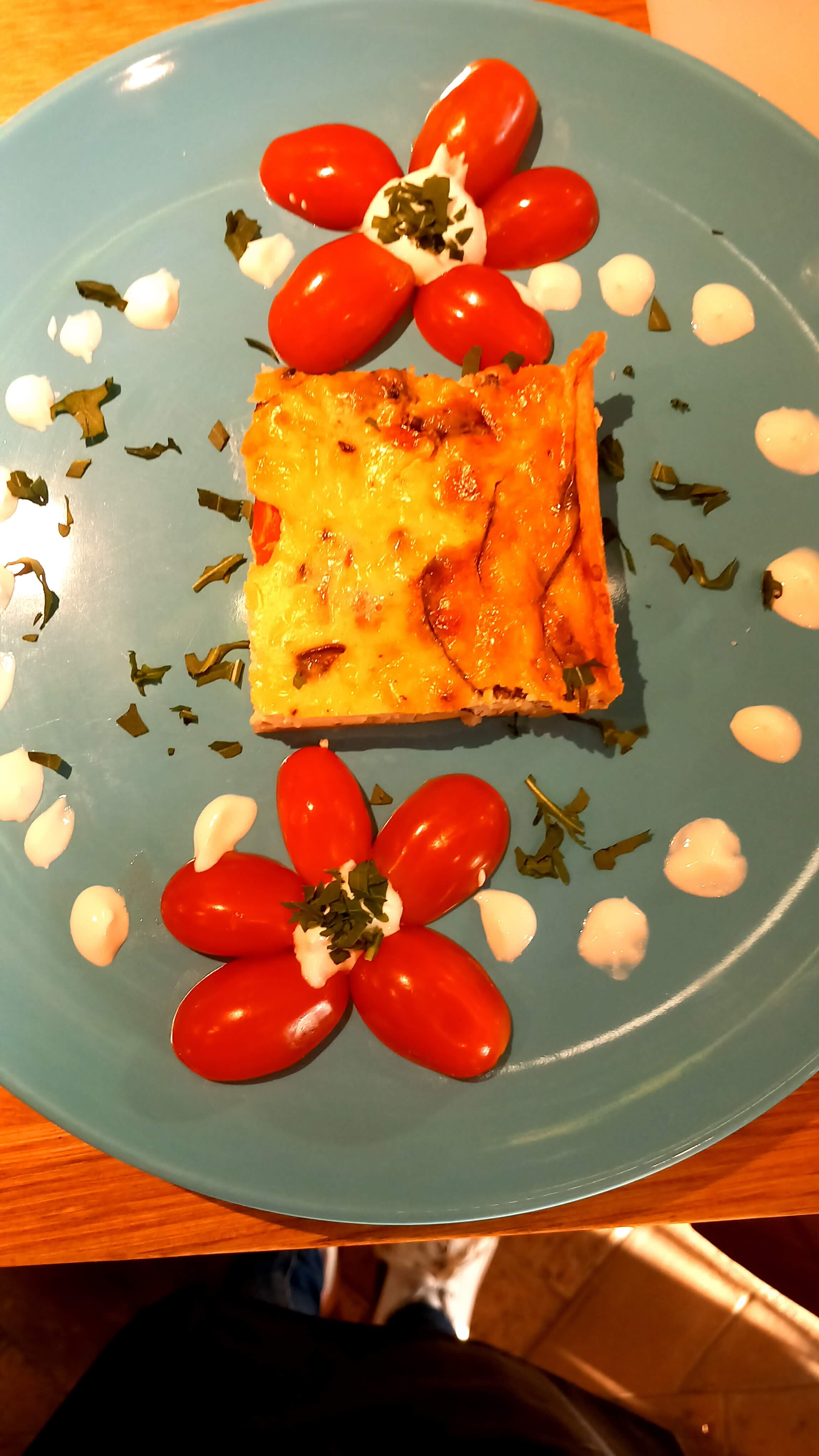 Beautifully plated dish with tomato decoration