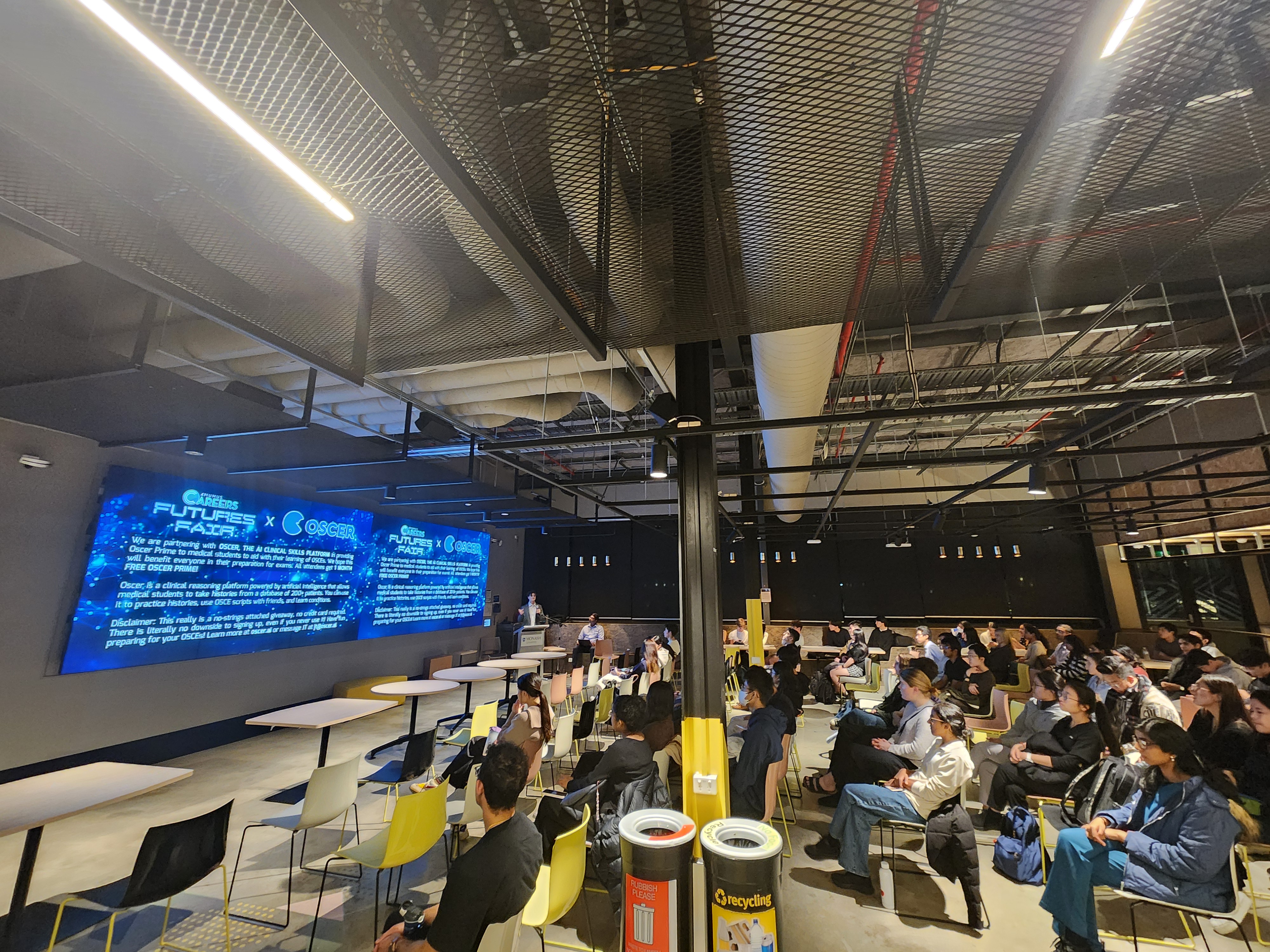 Future's Fair event with audience viewing presentation