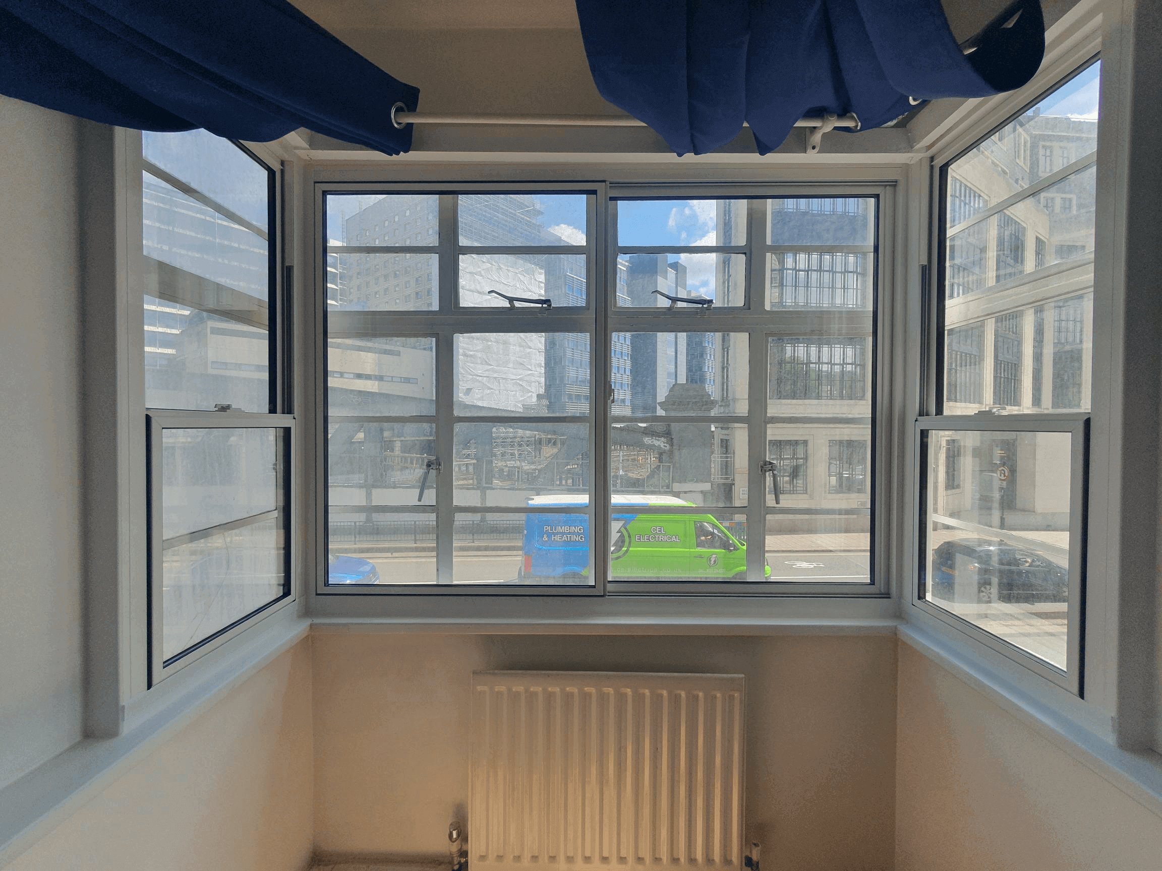 Bay window with secondary glazing overlooking London City skyline in Bank area residential property