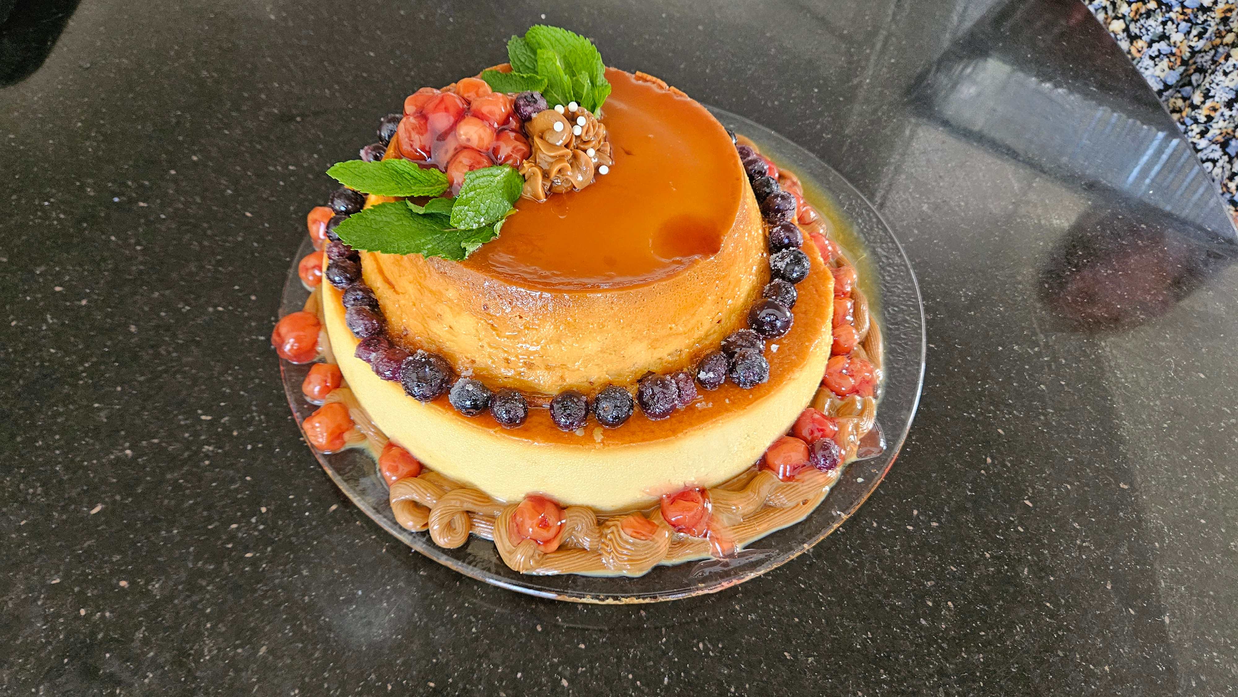 Tiered flan dessert with berries