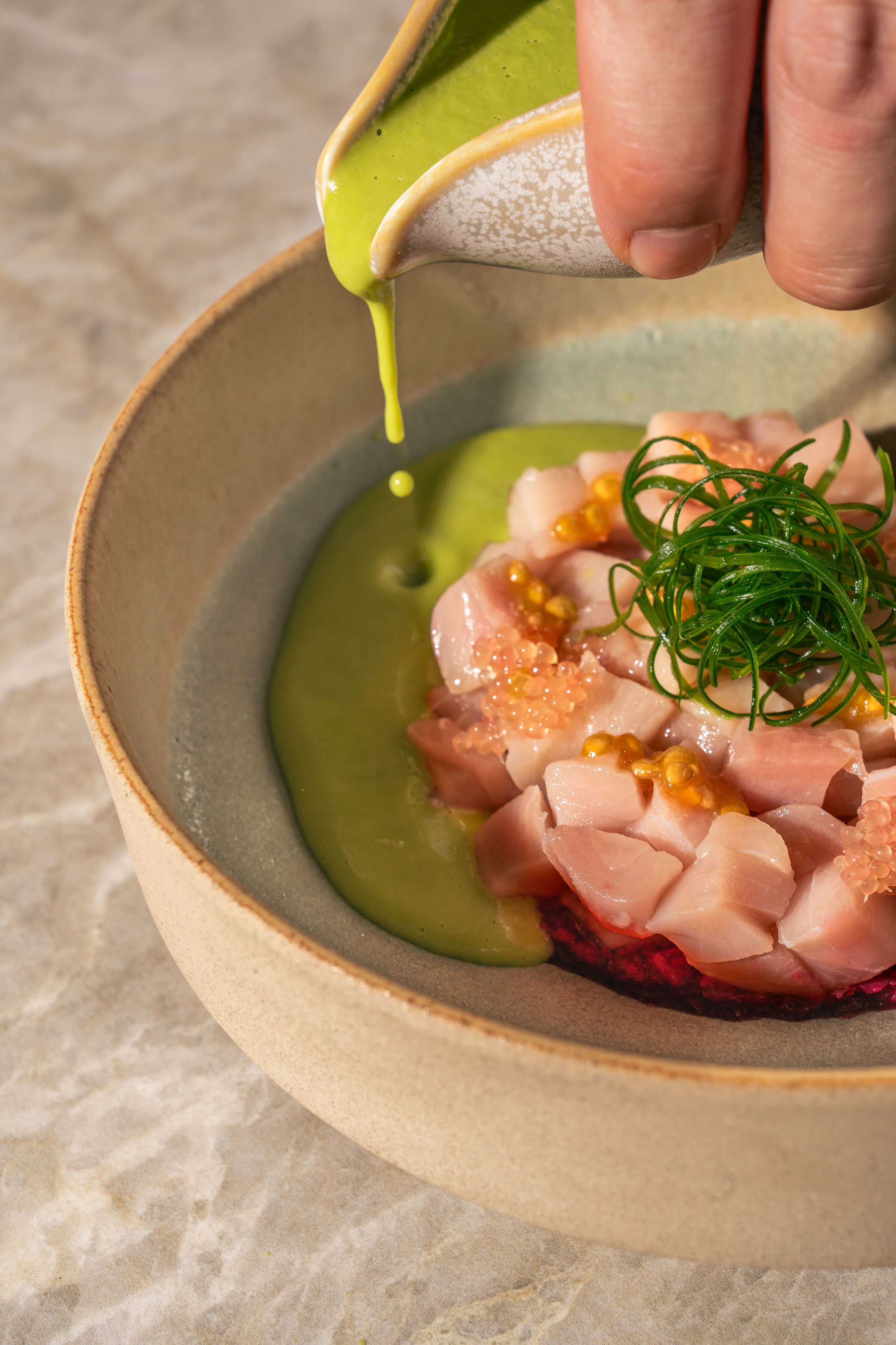 Hamachi tartare with green sauce and fresh herbs