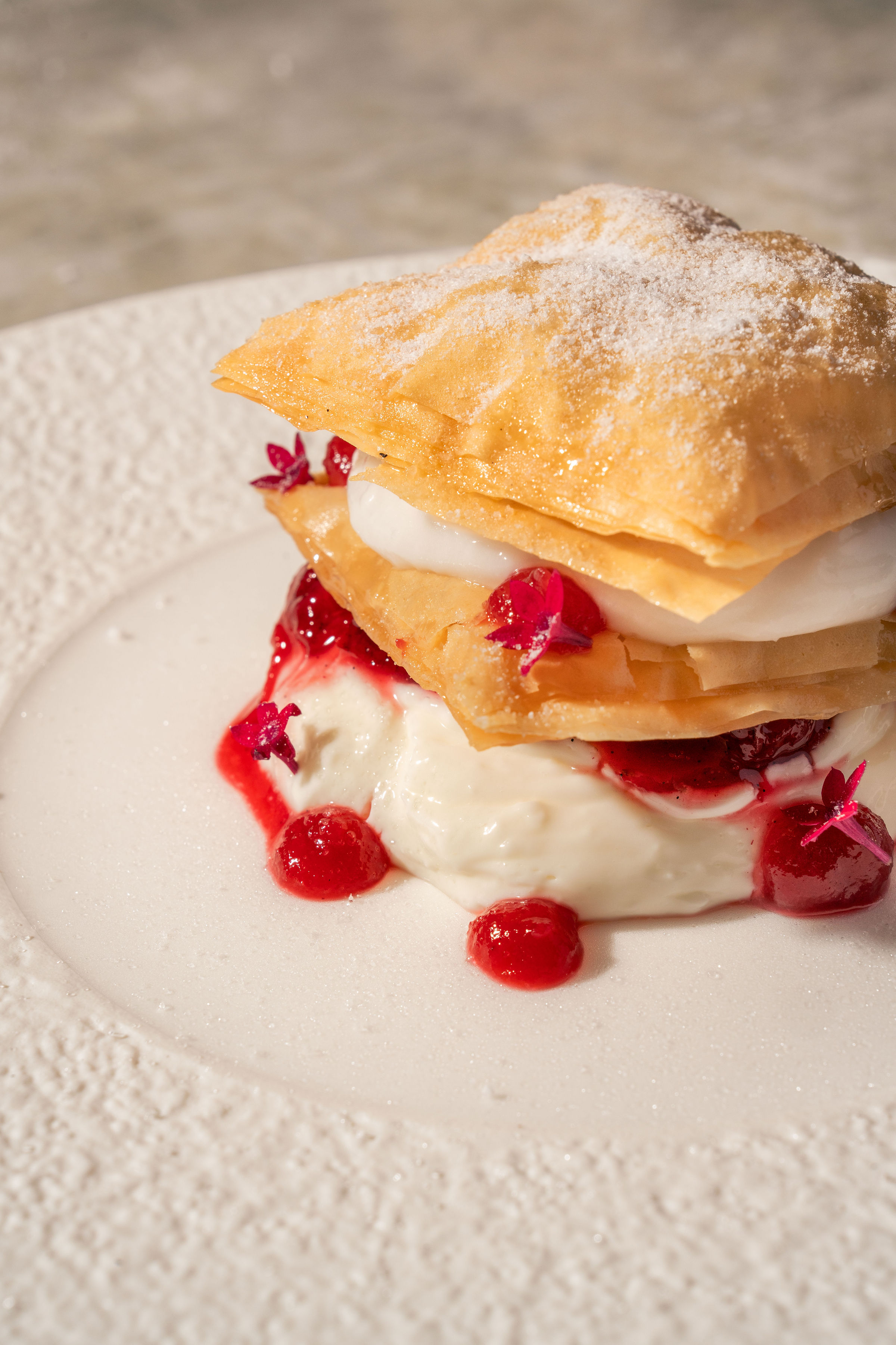 Layered Mediterranean-inspired pastry with cream and seasonal berries
