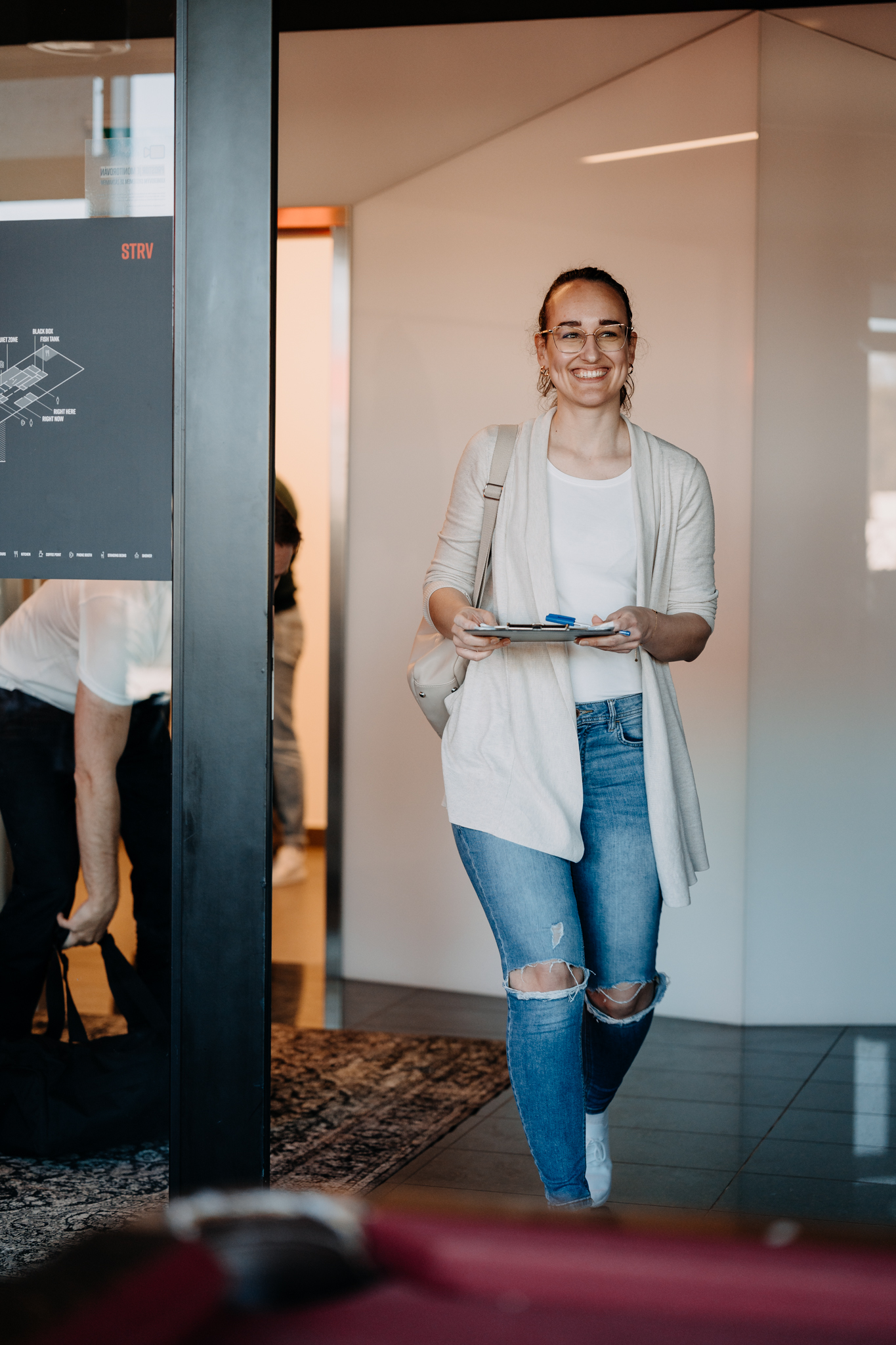 Participants holding hands in a cold plunge circle