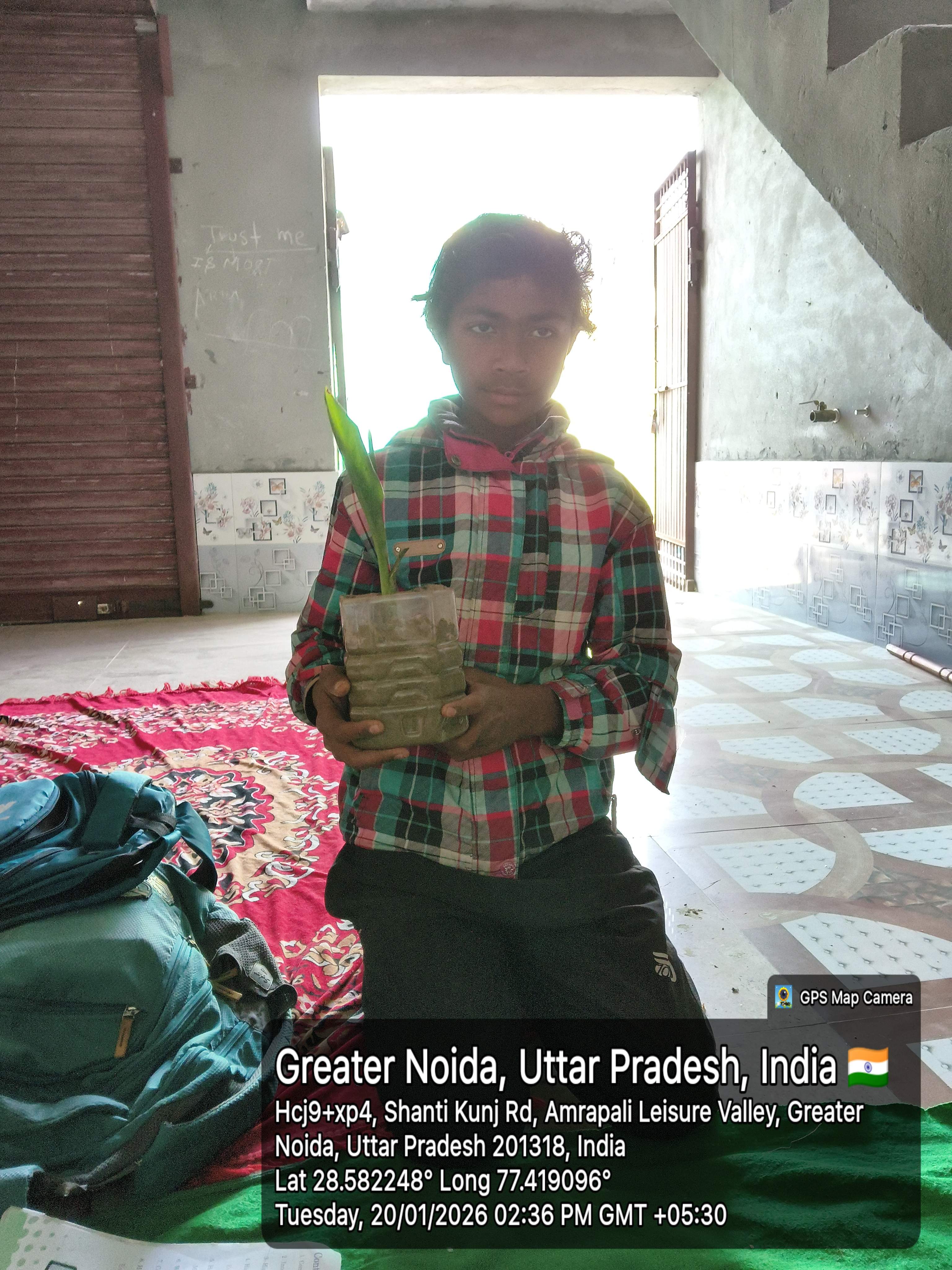 Your donation creates moments like this - child learning with plant