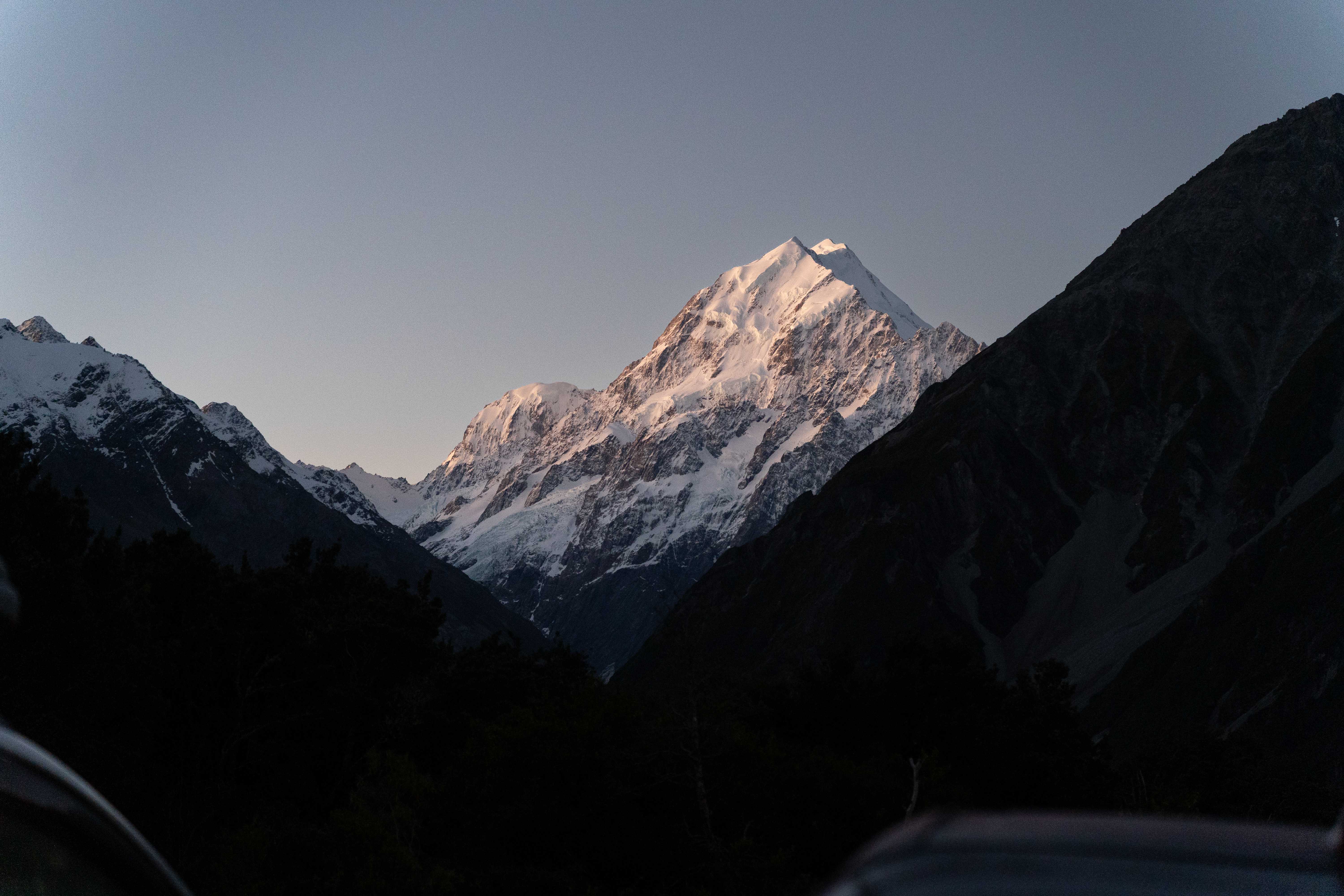Mount Cook's snow-capped peak catching the last light at dusk