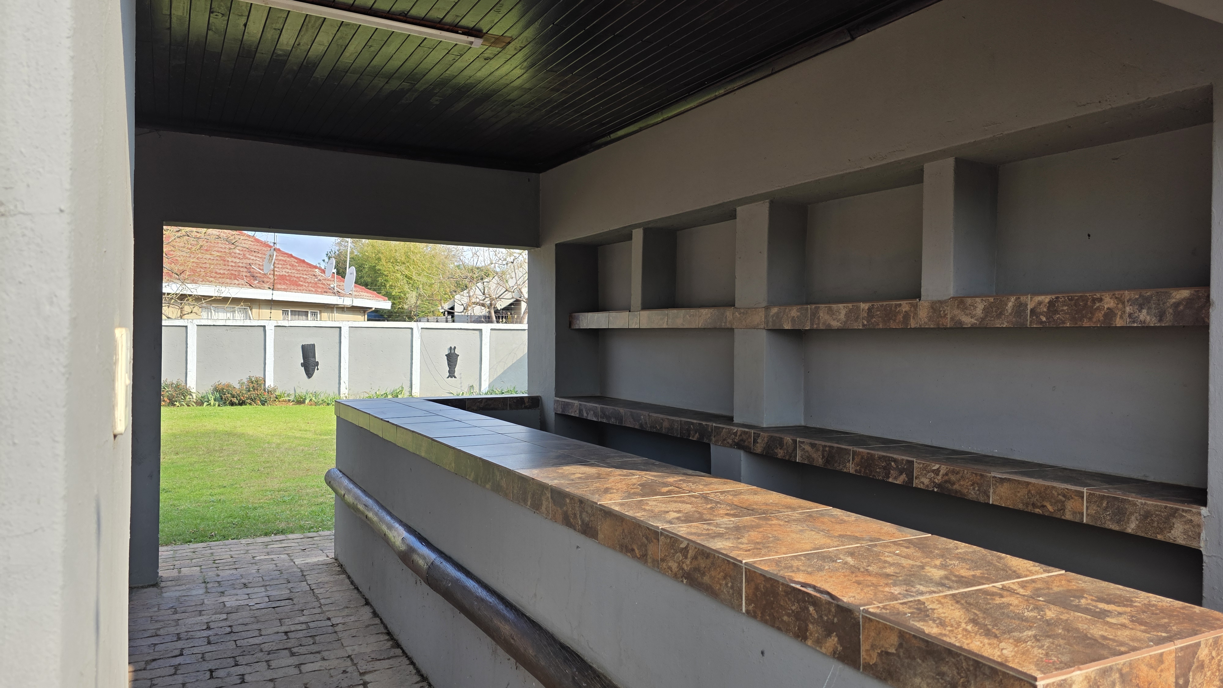 Outdoor braai area with garden view