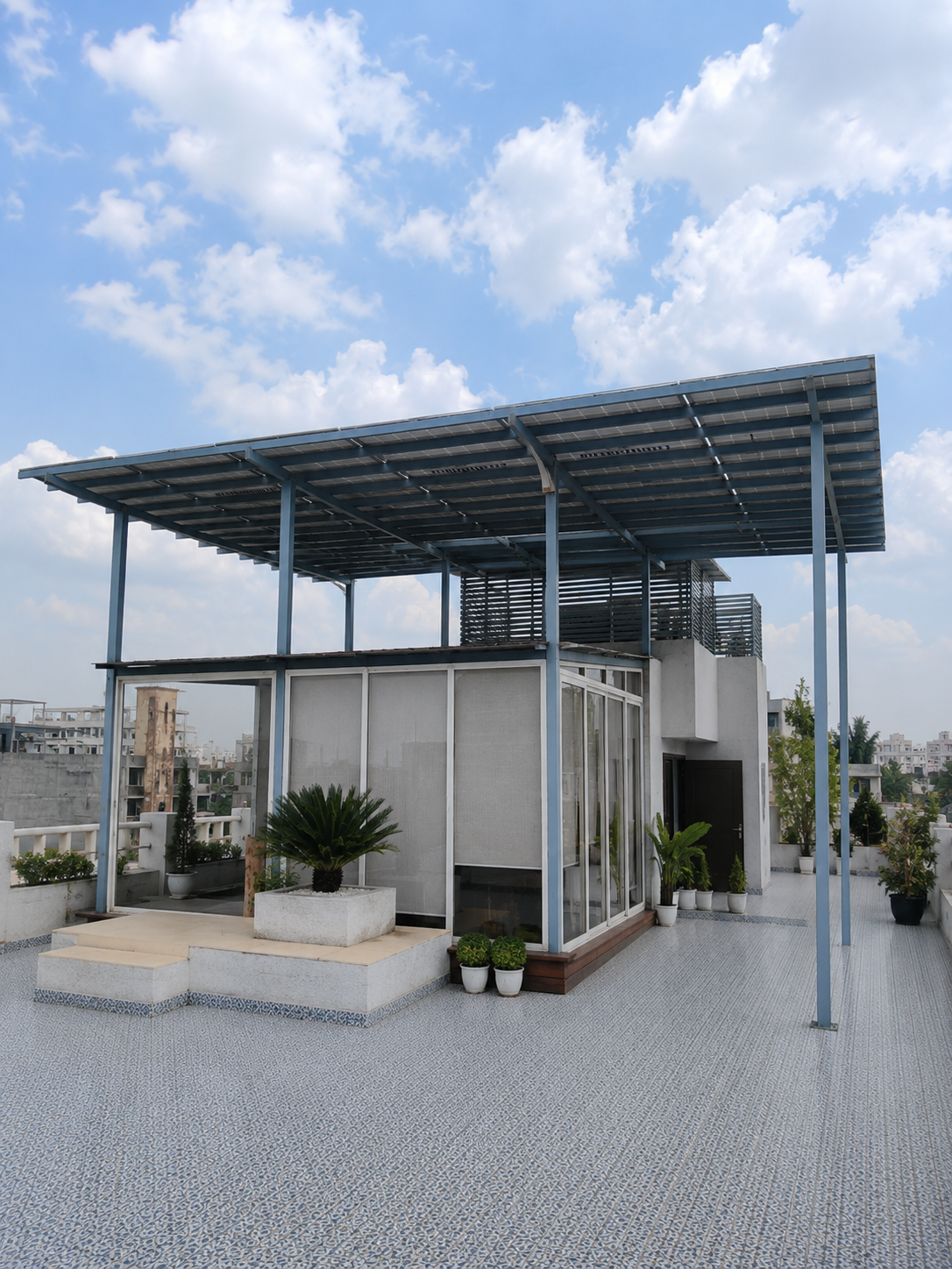 Rooftop terrace with a solar panel canopy providing shaded outdoor space