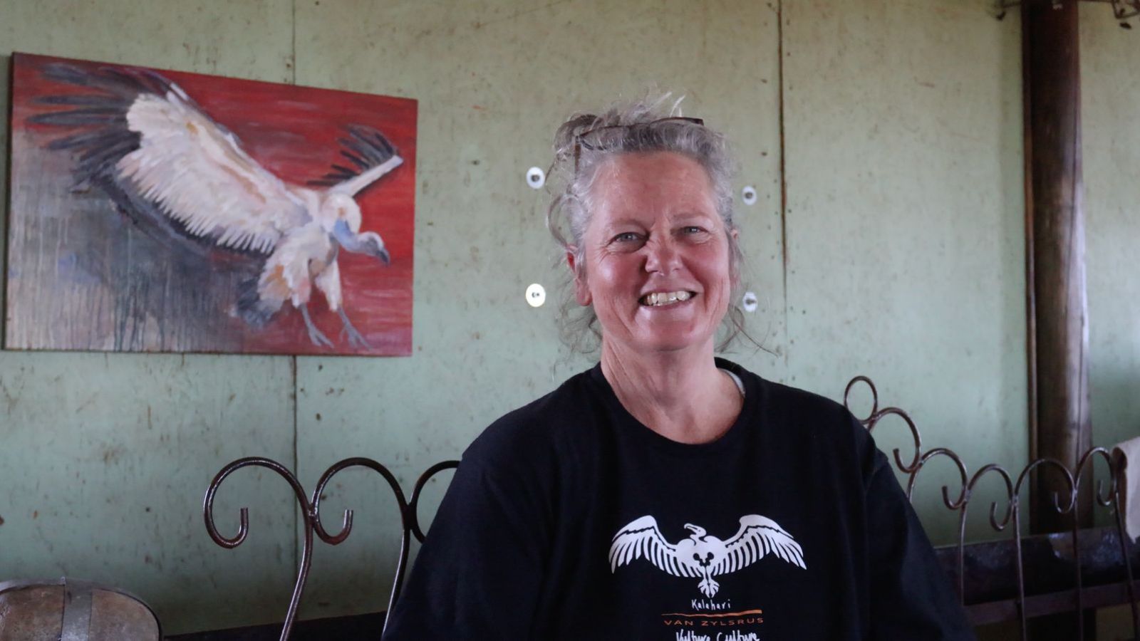 Portrait of artist with geoglyph artwork in background