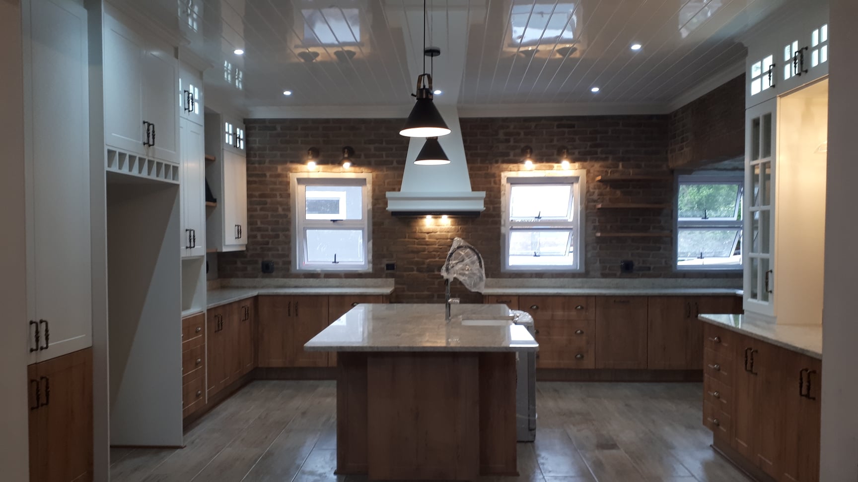Farmhouse Kitchen with Brick Feature Wall