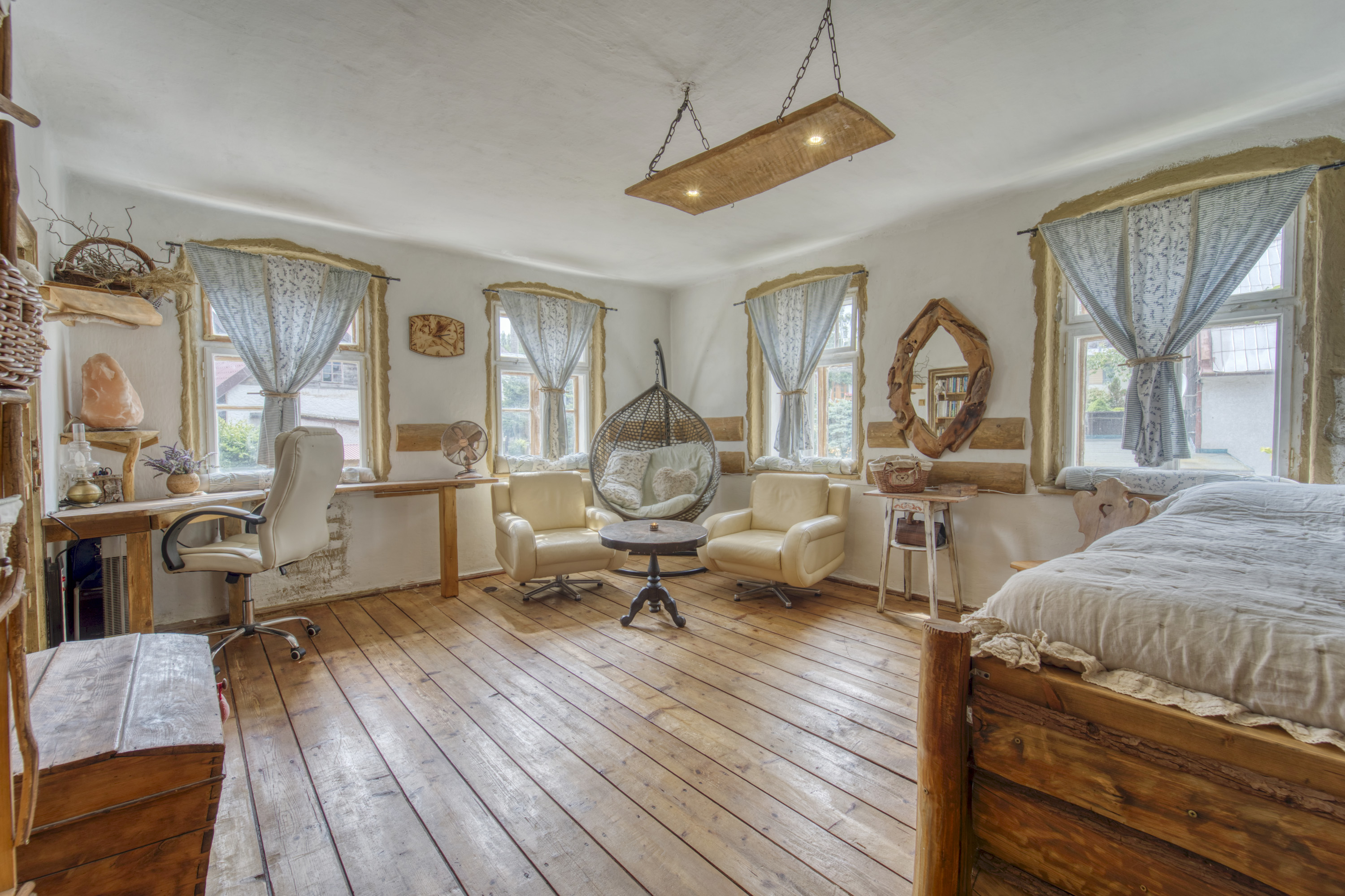 Rustic bedroom and living space with wood details