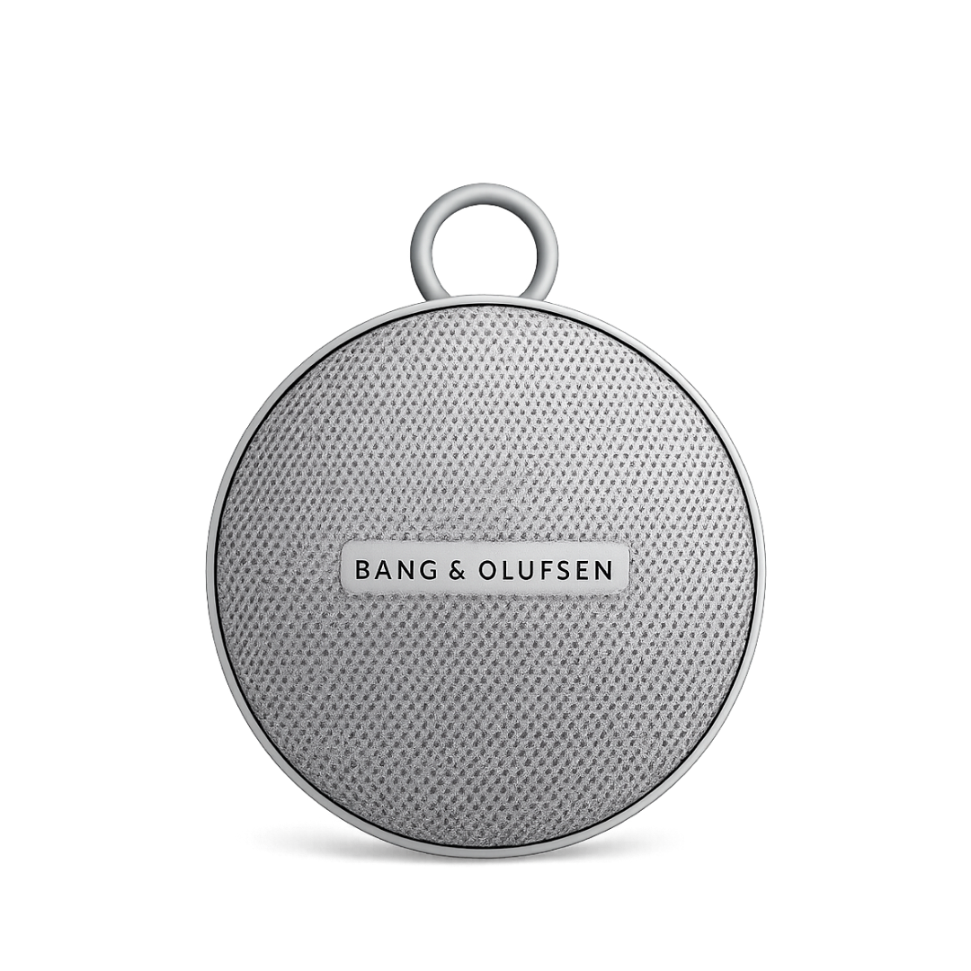 Bang and Olufsen circular fabric speaker with metallic ring rendered front-facing