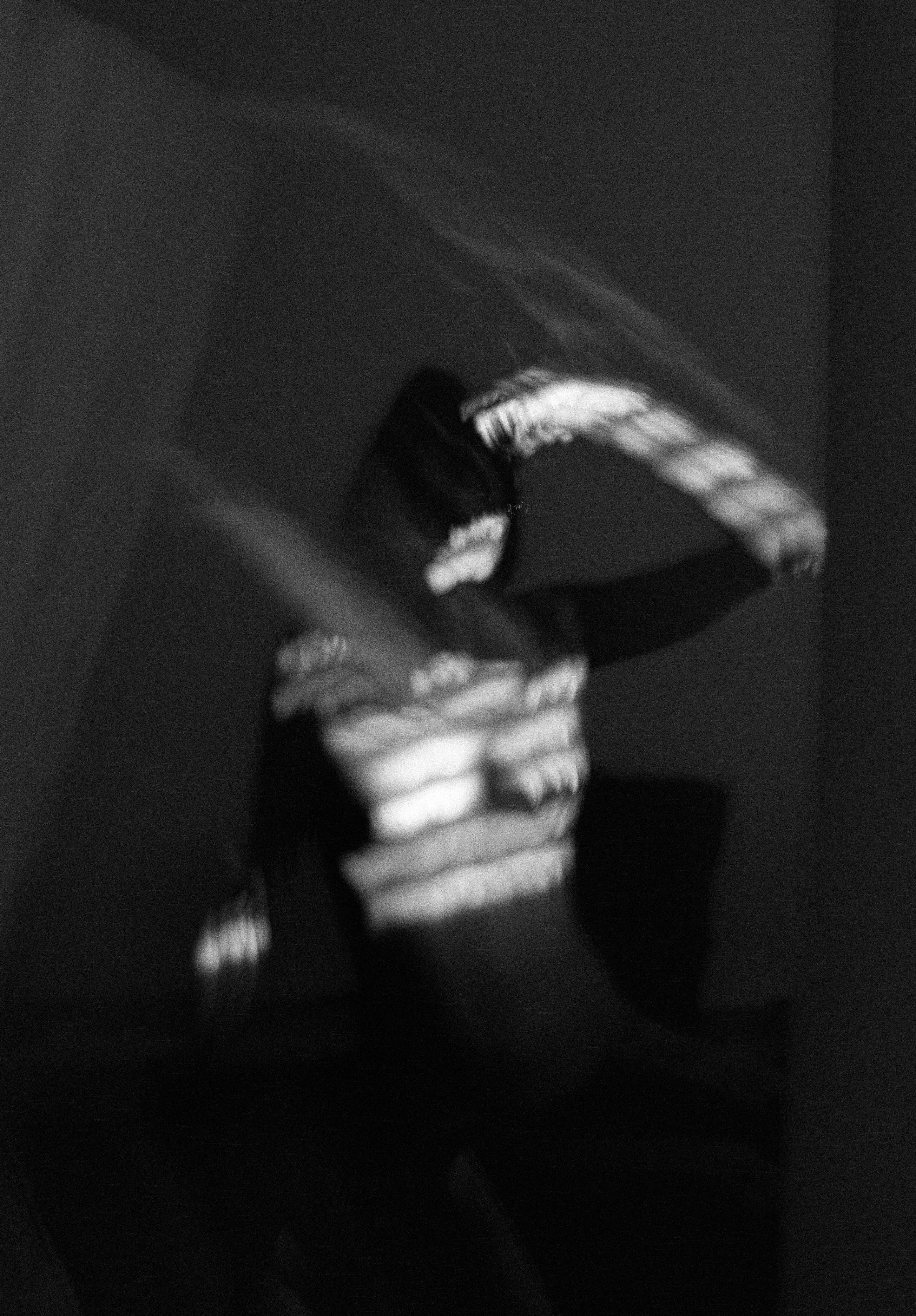 Blurred black and white image of a person in motion