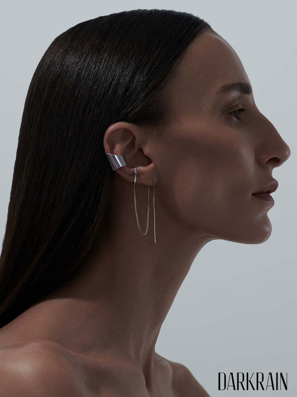 Dark Rain beauty profile — silver ear cuff and dark hair