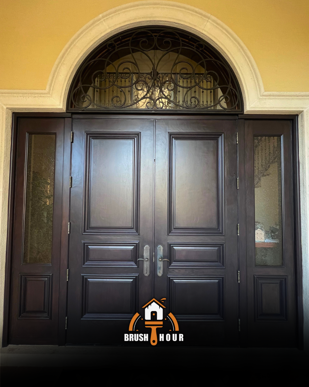 Elegant dark wooden doors with arch