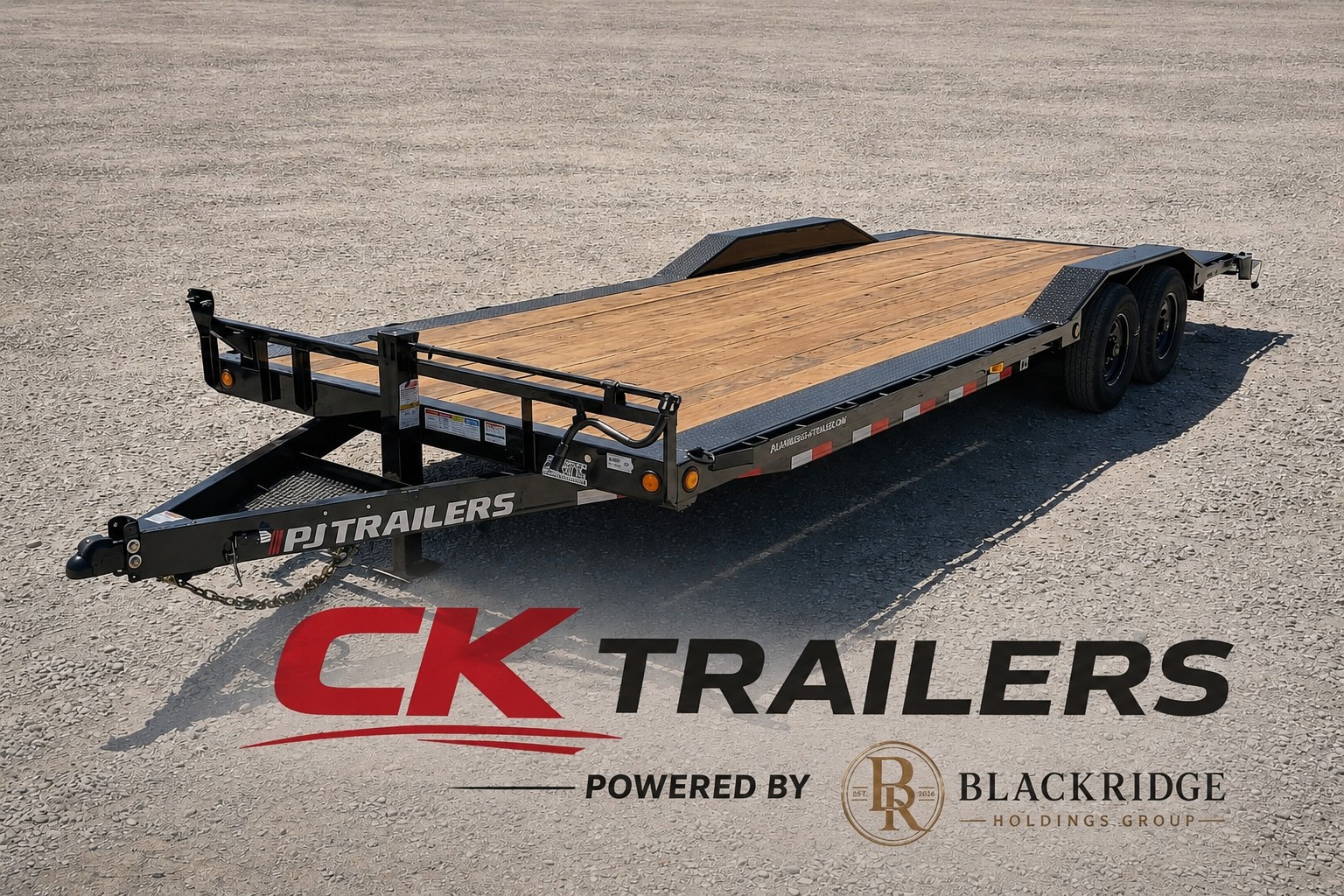 Black PJ Trailers 24-foot 14K equipment trailer with wood plank deck, drive-over fenders, and heavy-duty ramps — CK Trailers Powered by Blackridge Holdings Group