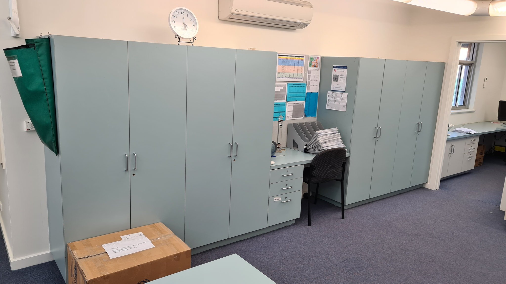 Modern barn-style kitchen renovation with white cabinetry and timber island