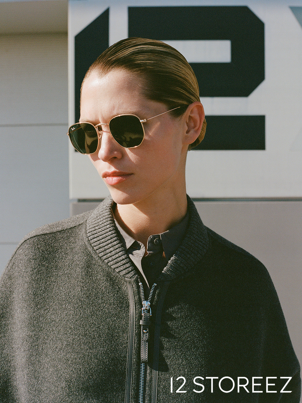 12 Storeez portrait — model in sunglasses and grey knitwear