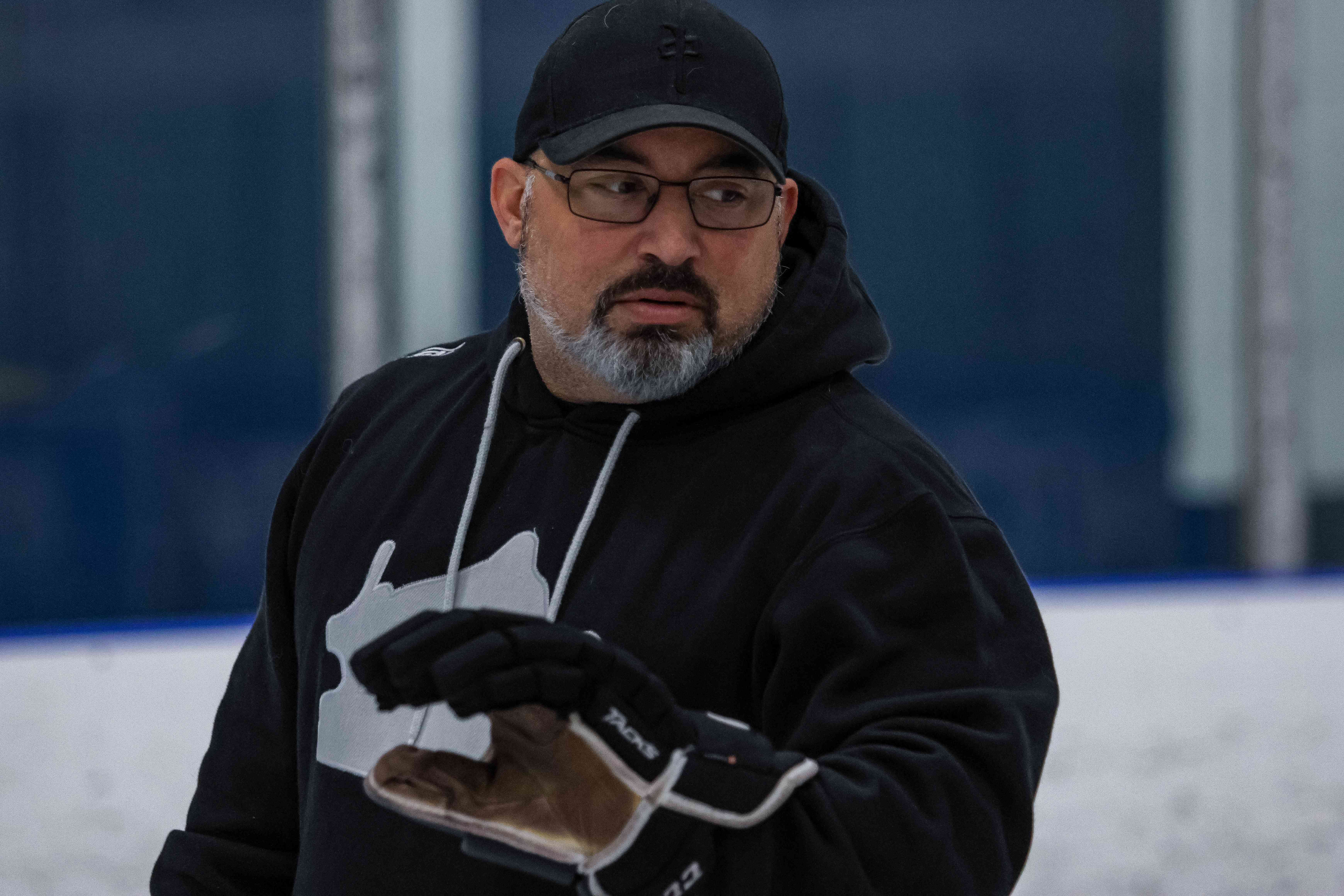 Coach Steve Schut running a drill on the ice