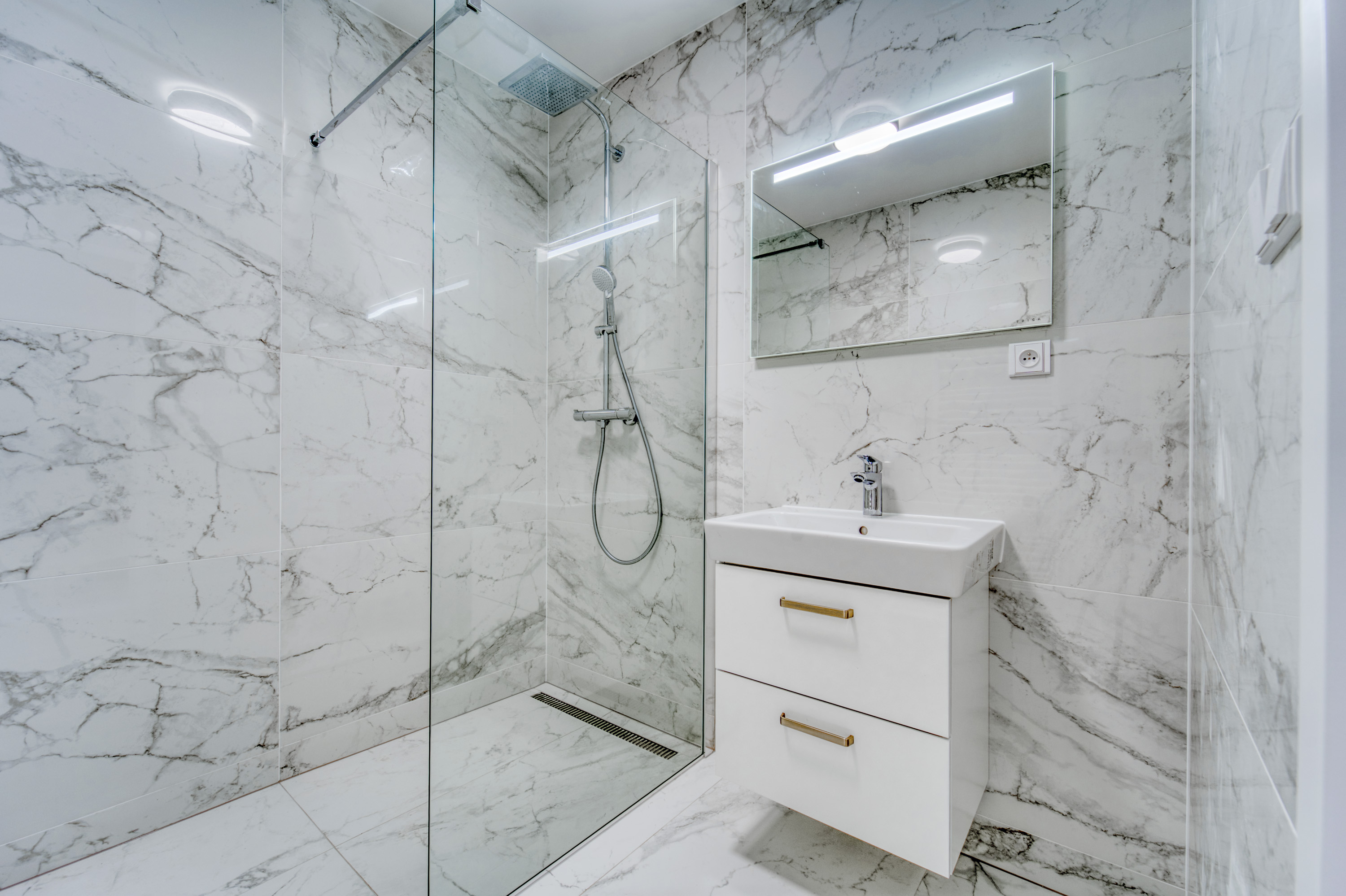 Marble bathroom with glass walk-in shower