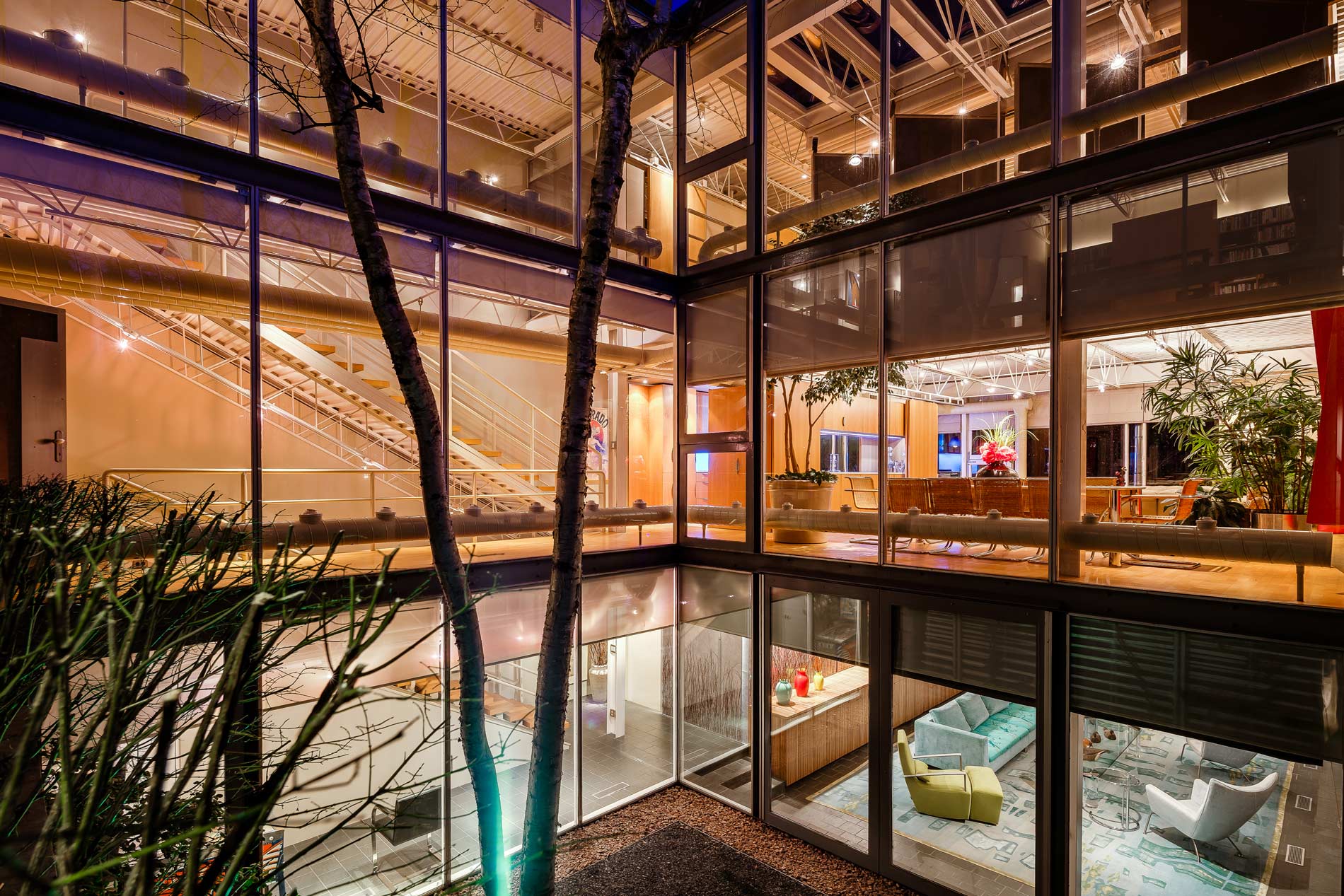 Modern glass house exterior at night