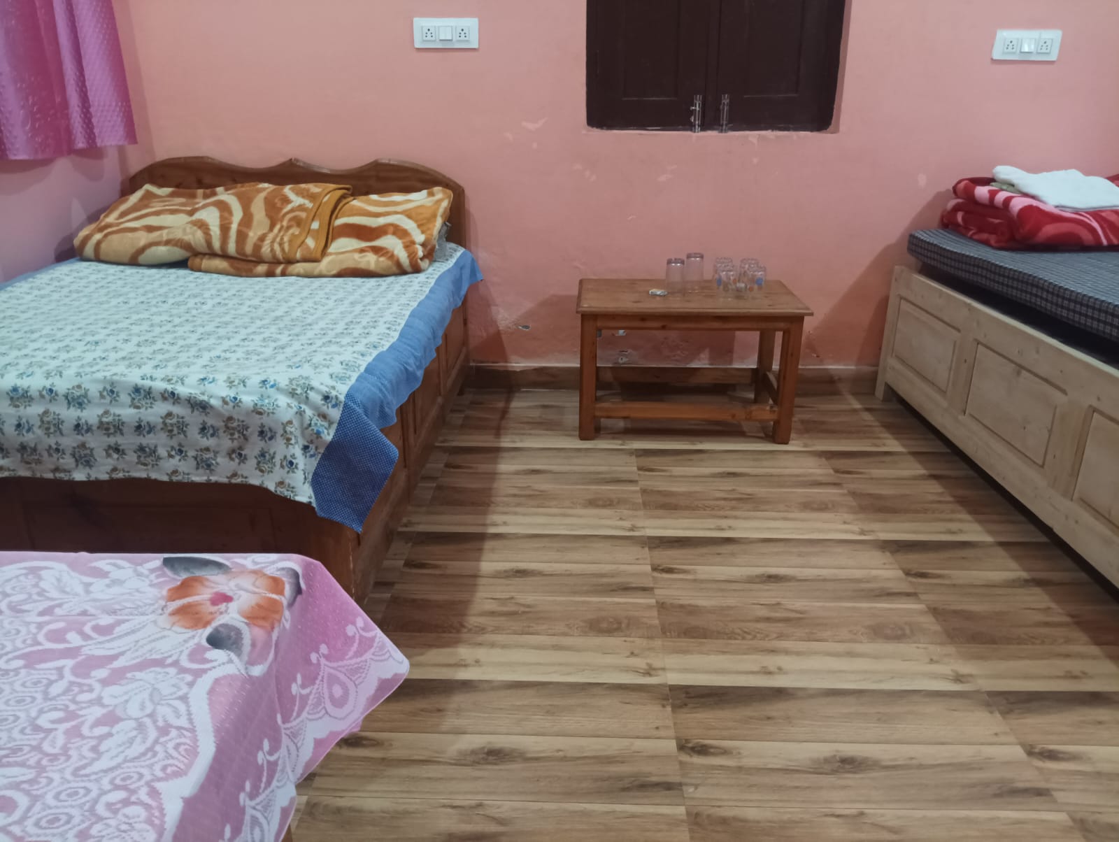 Spacious room with multiple beds for groups