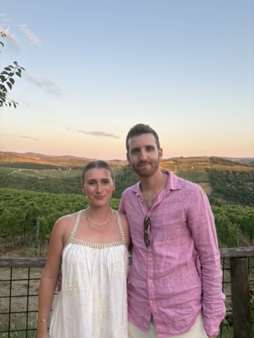 Maxx and Kate Lipman at a Tuscan vineyard at sunset, Italy 2025