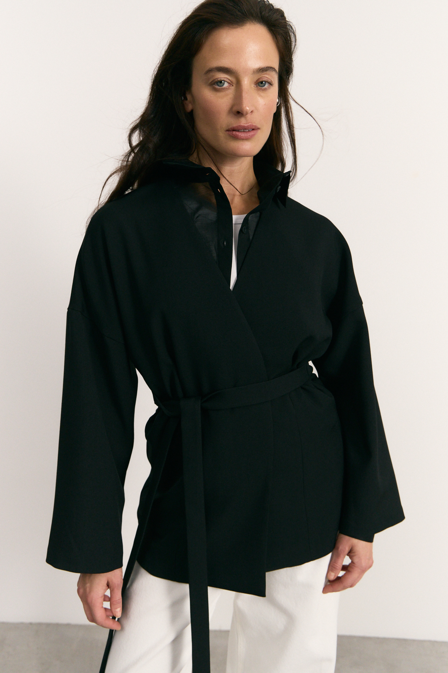 Catalogue before retouching — black belted wrap jacket
