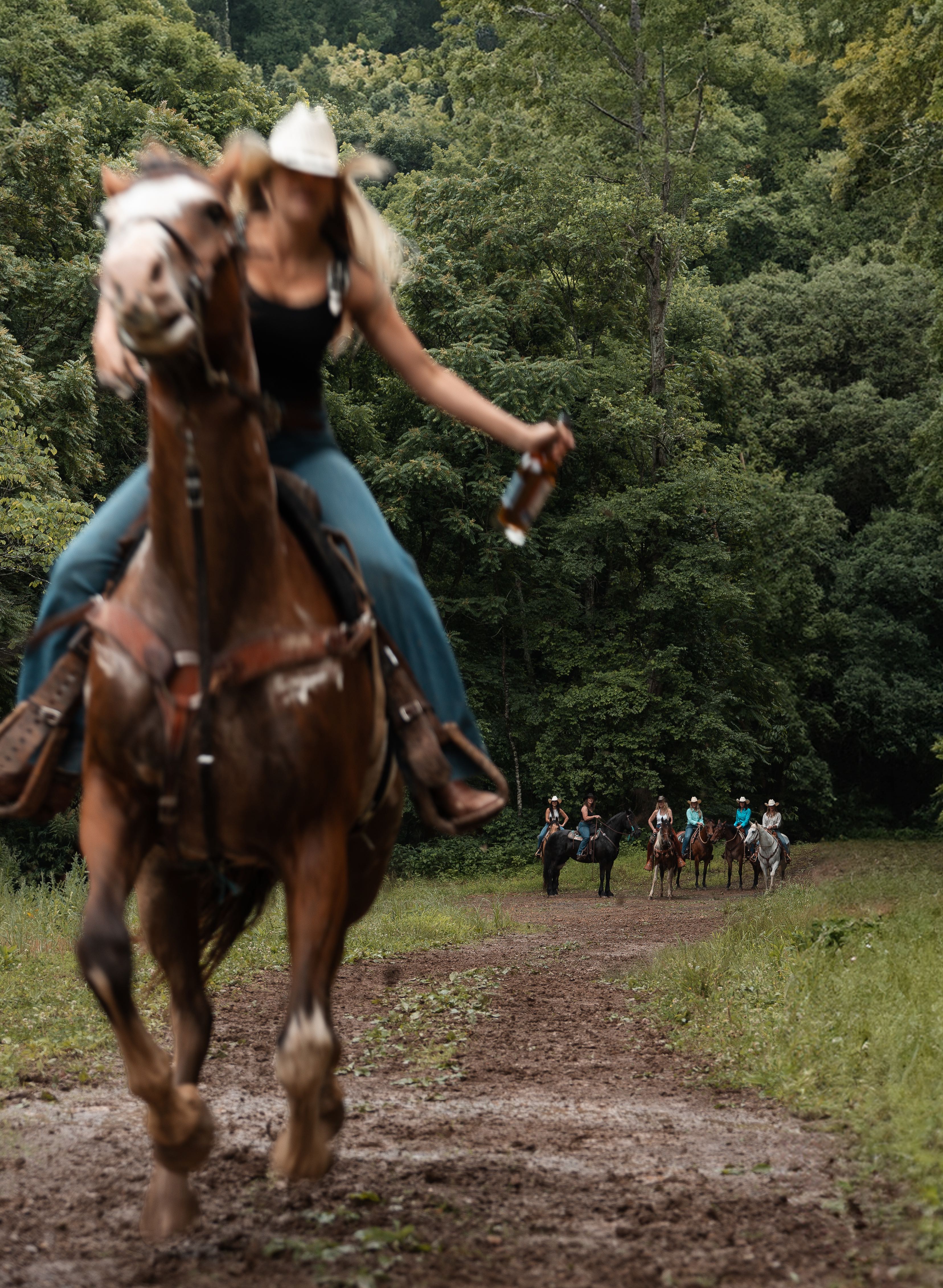 Woman on horseback with Silverbelly Whiskey