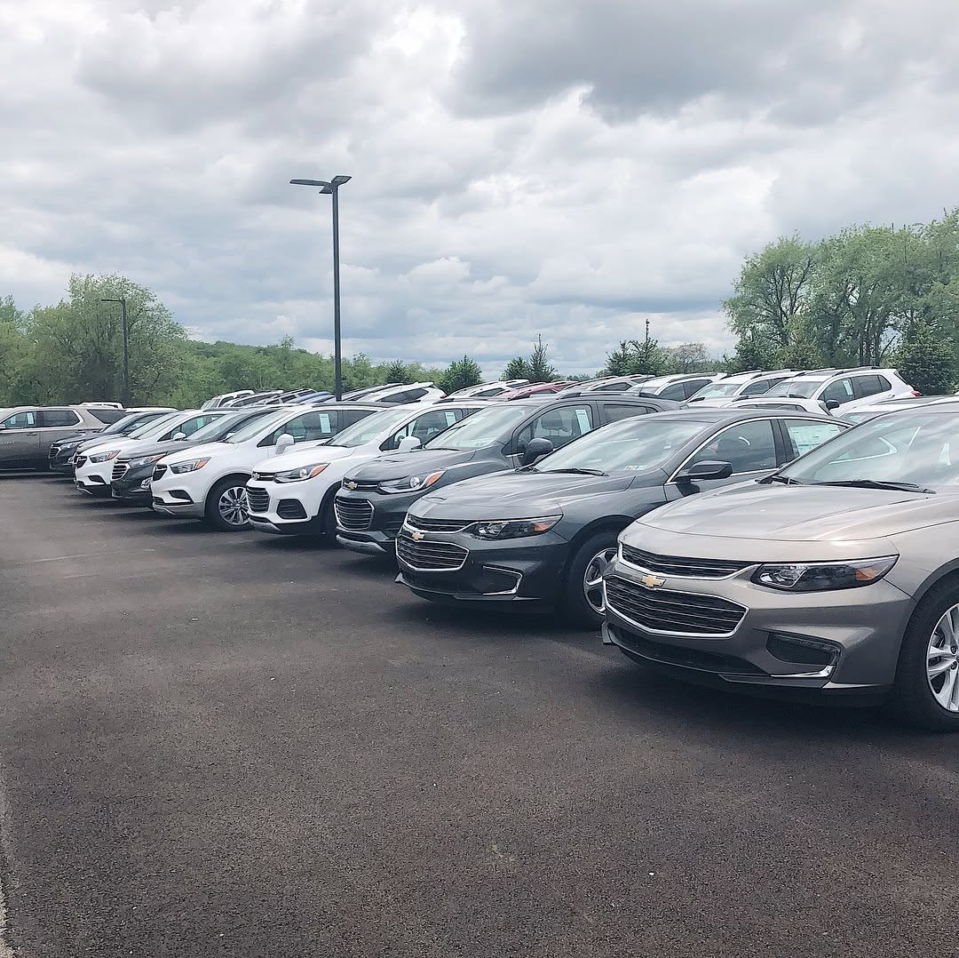 Rows of new Chevrolet vehicles in a dealership lot