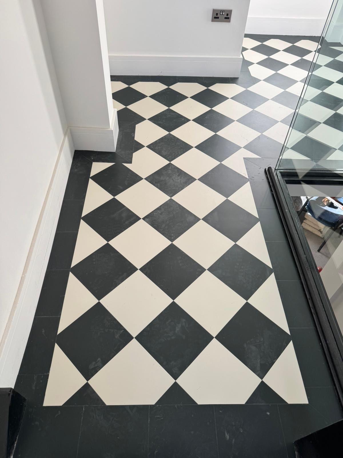 Hallway with black and white checkered floor tiles