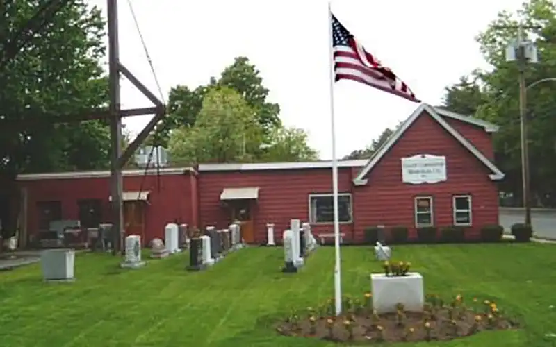 Red showroom building with landscaping