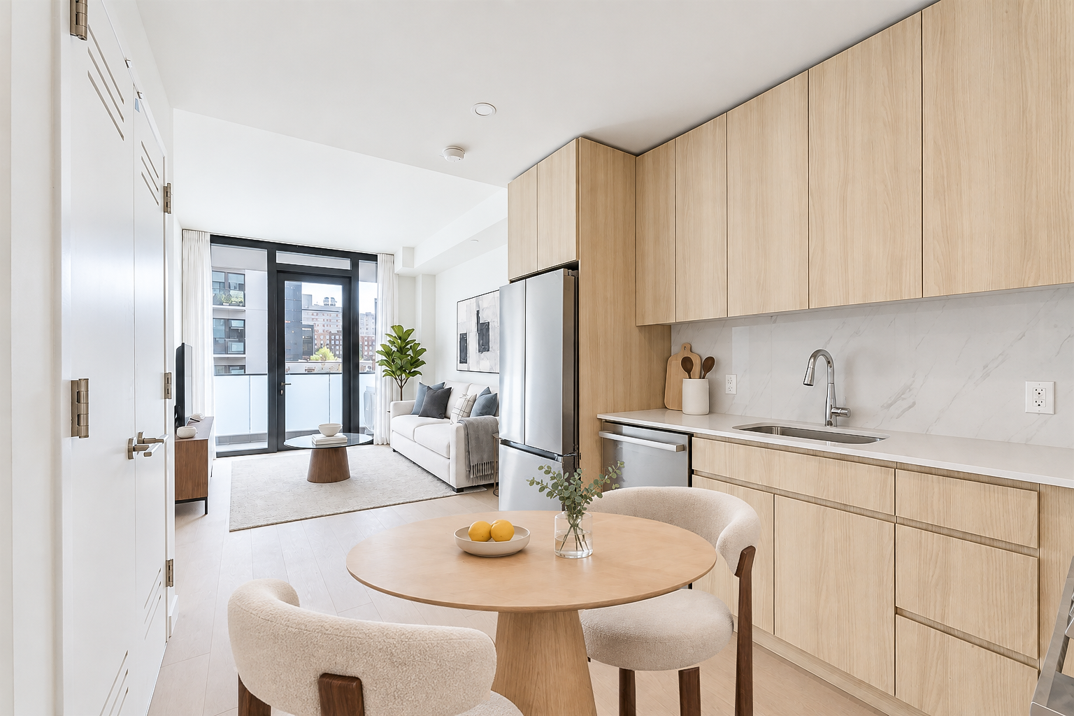 Open-plan living and dining space with warm wood cabinetry and a private balcony