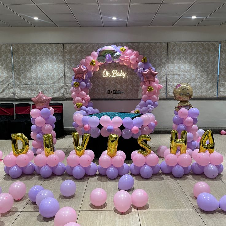 Oh Baby neon sign with elegant pink and purple balloon arch